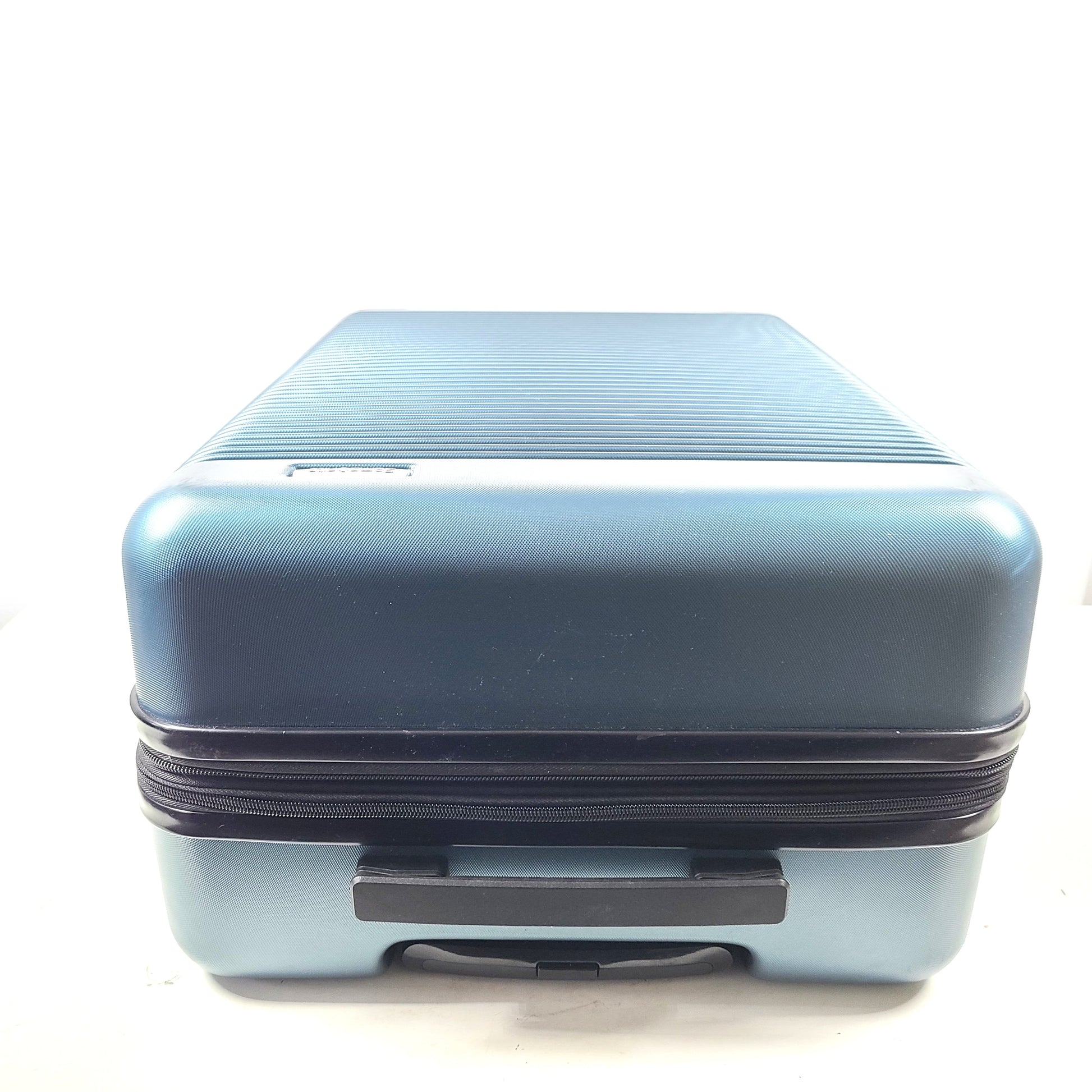 Samsonite blue hard-shell spinner luggage with front branding and a clean interior.
