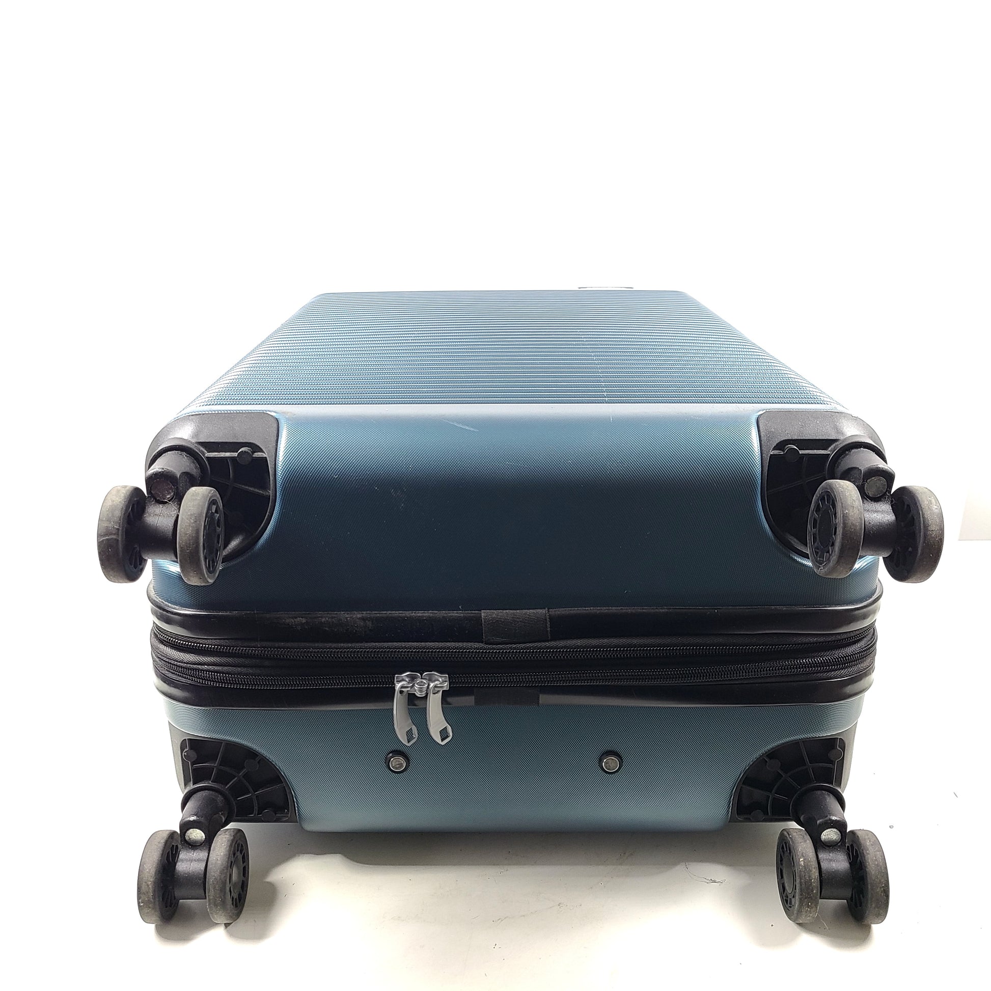 Samsonite blue hard-shell spinner luggage with front branding and a clean interior.