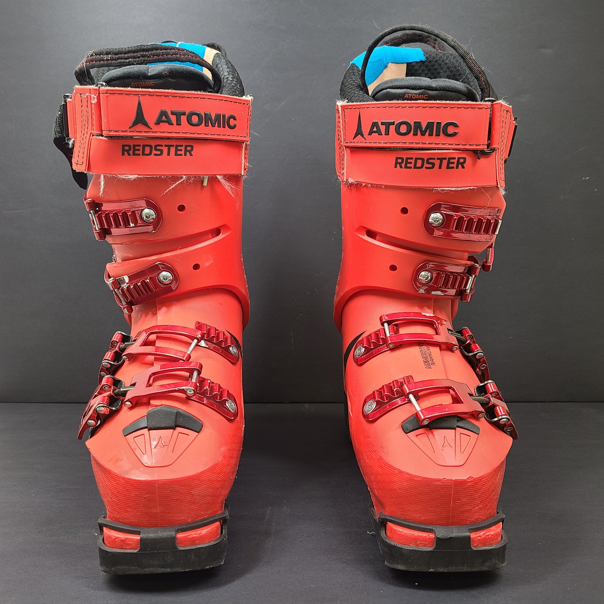 High-performance Atomic Redster World Cup 130 ski boots in red with race-oriented 130 flex and ISO 5355 compatibility.