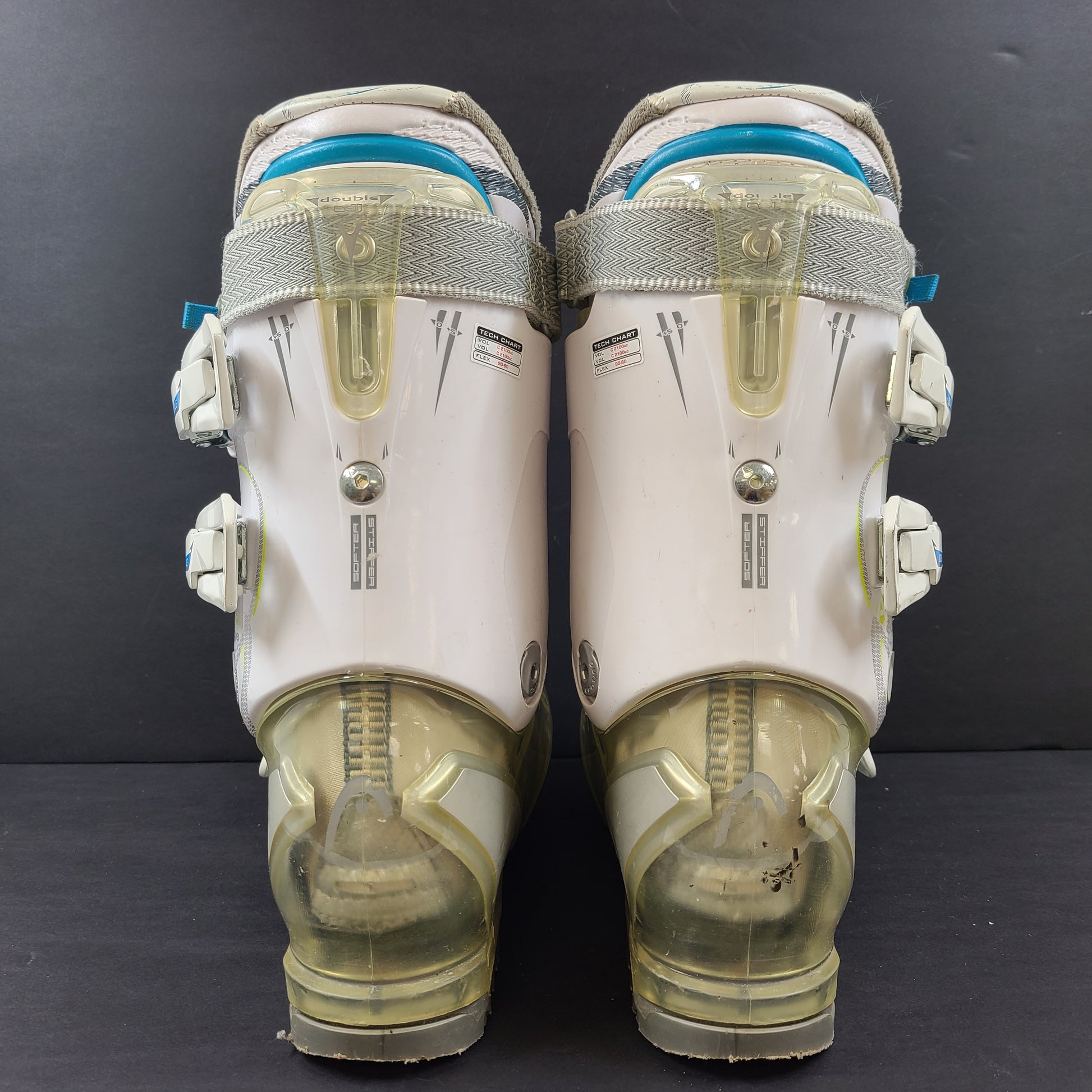 Pair of Head Adapt Edge 100 ski boots in transparent, white and blue with Energy Frame and Soft Walk heel for supportive alpine performance.
