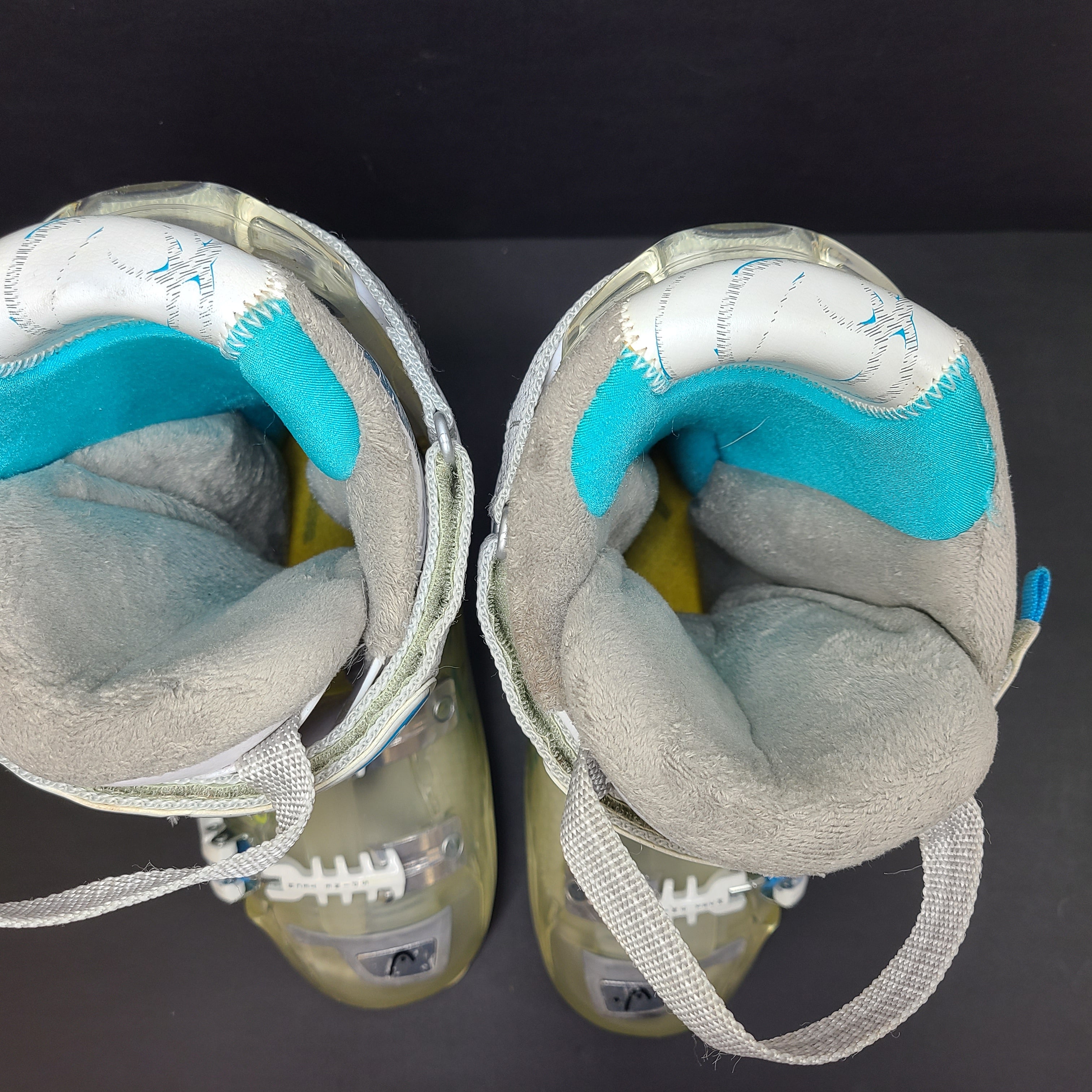 Pair of Head Adapt Edge 100 ski boots in transparent, white and blue with Energy Frame and Soft Walk heel for supportive alpine performance.