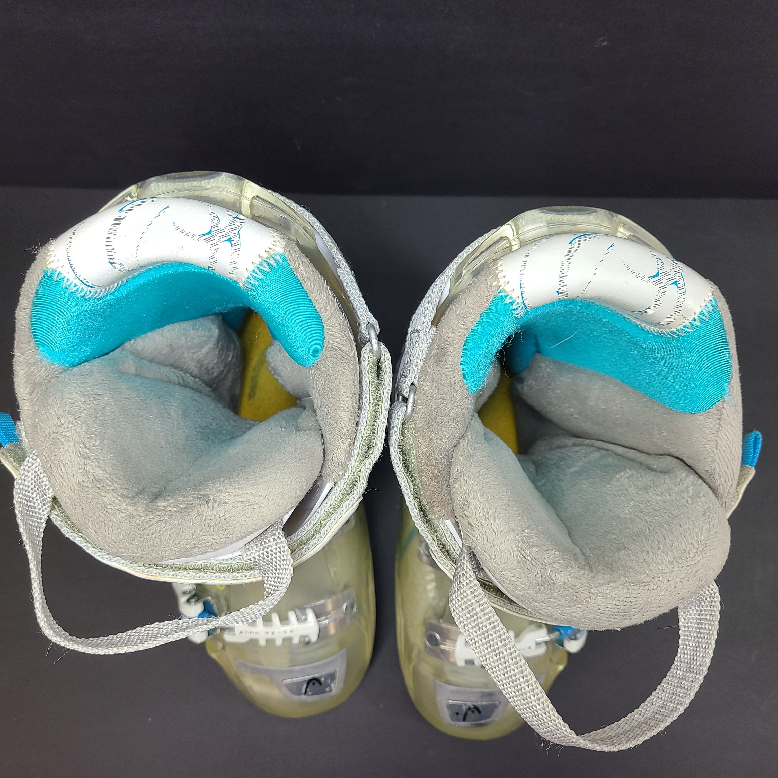 Pair of Head Adapt Edge 100 ski boots in transparent, white and blue with Energy Frame and Soft Walk heel for supportive alpine performance.