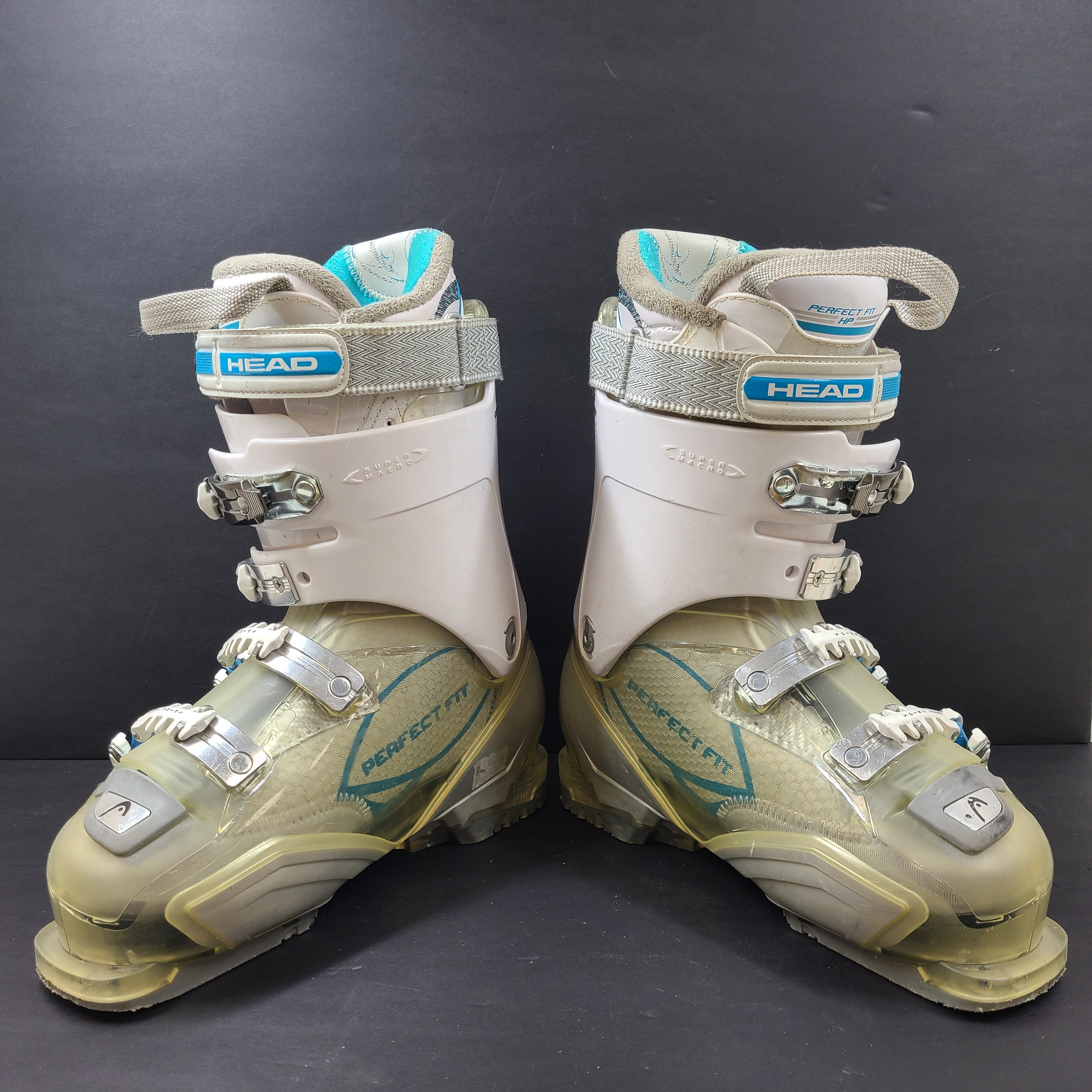 Pair of Head Adapt Edge 100 ski boots in transparent, white and blue with Energy Frame and Soft Walk heel for supportive alpine performance.