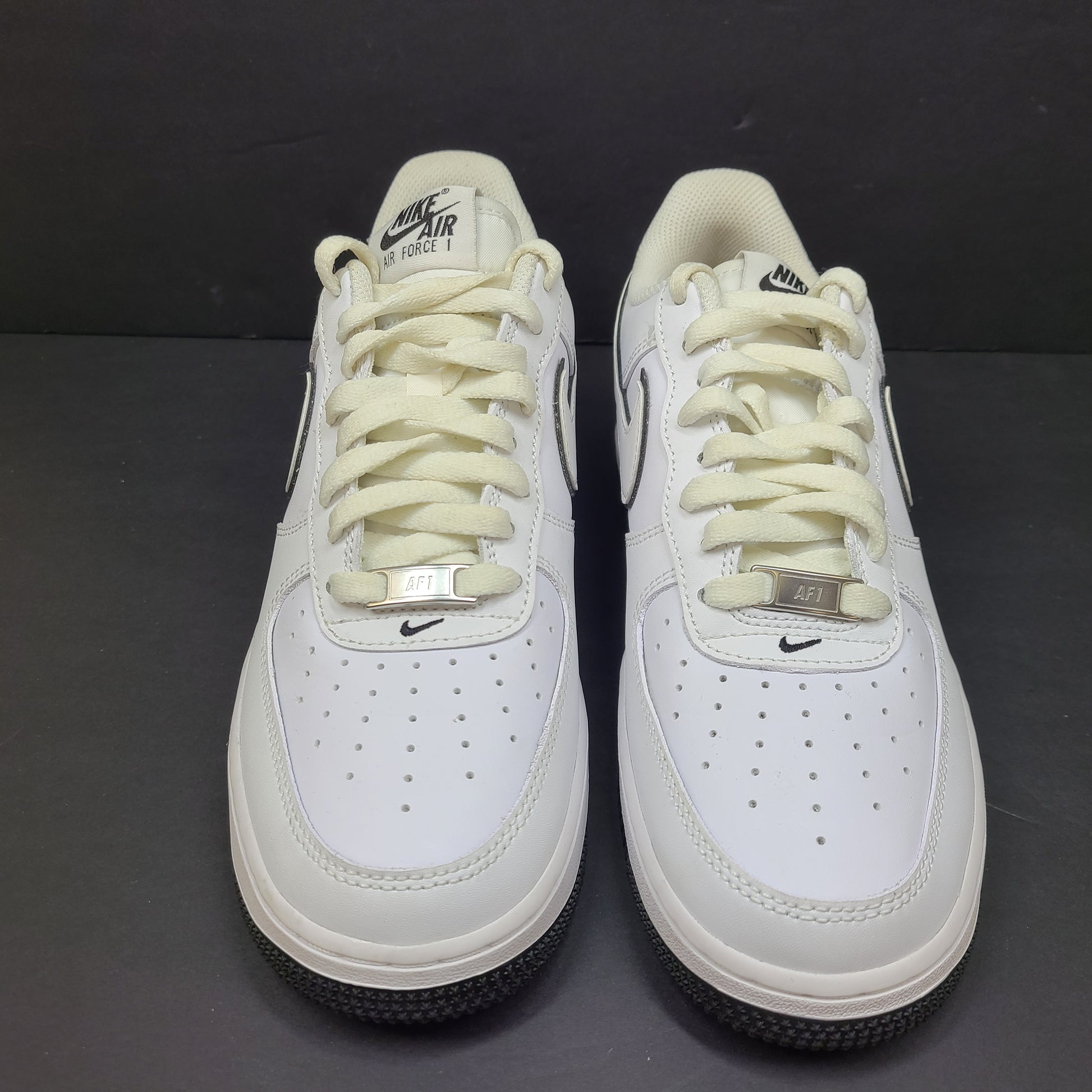 Classic Nike Air Force 1 Low in white with black accents, size US 7.5, model DV0818-103.