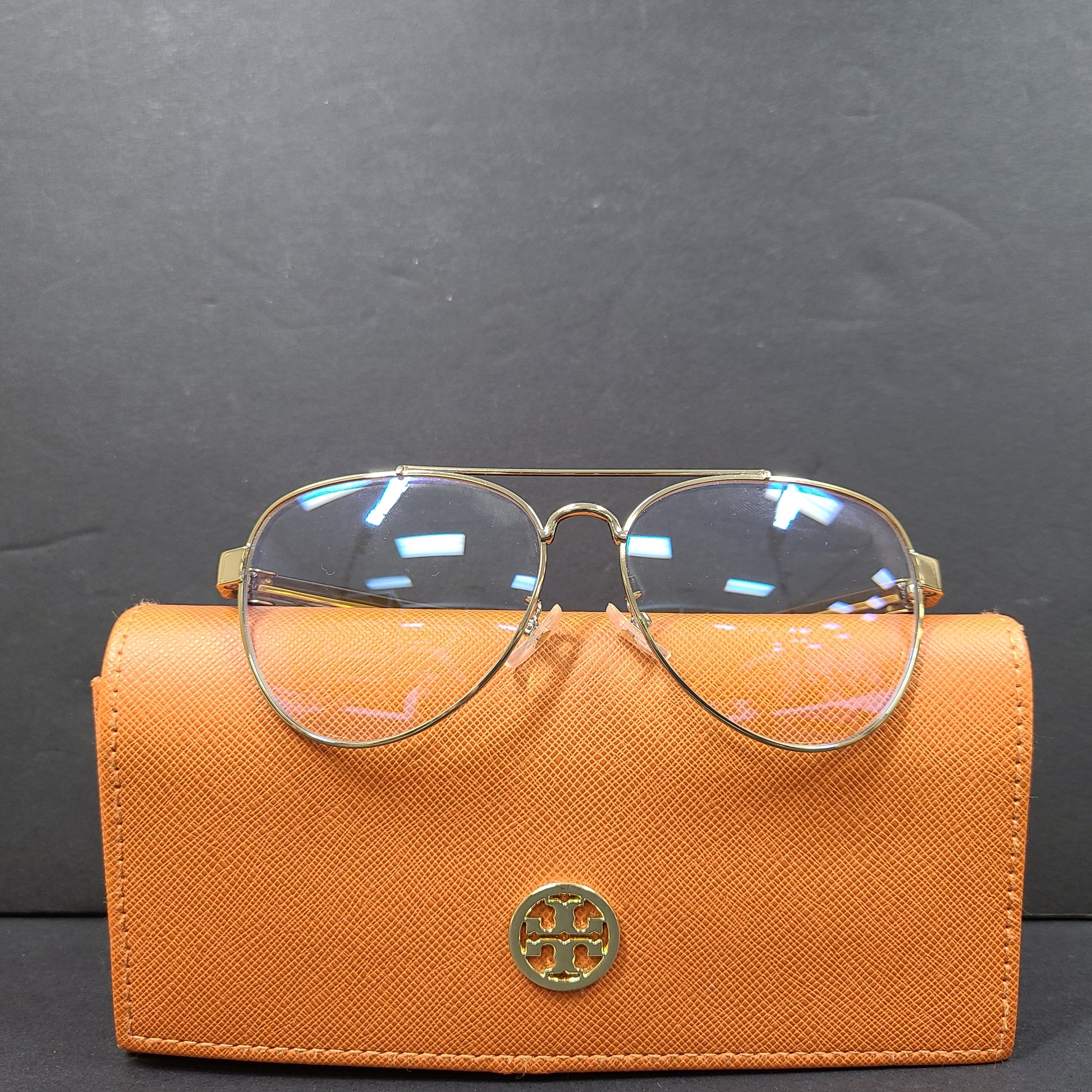 Tory Burch pilot-style metal-frame glasses in gold with 55mm eye size and branded temple detailing.