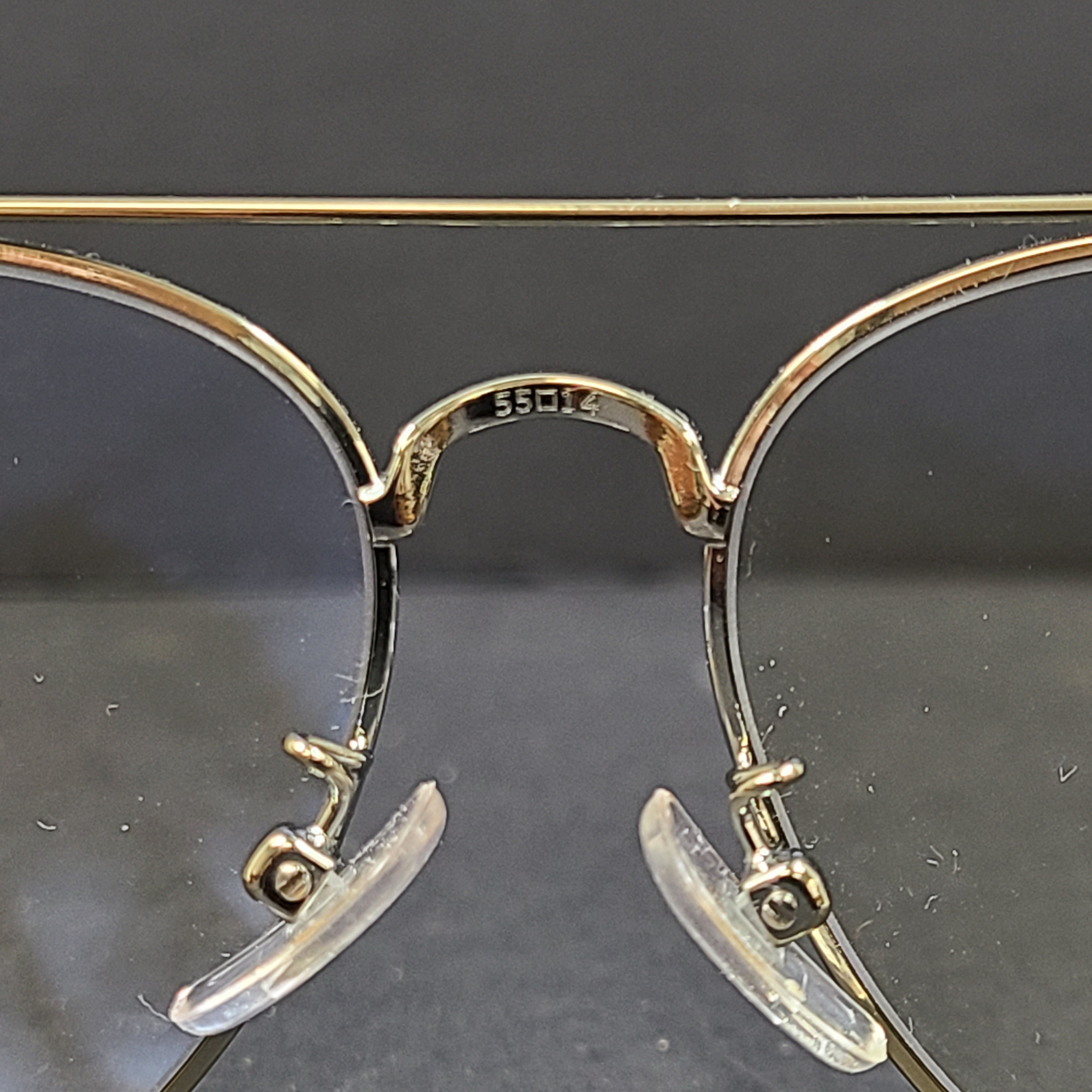 Tory Burch pilot-style metal-frame glasses in gold with 55mm eye size and branded temple detailing.