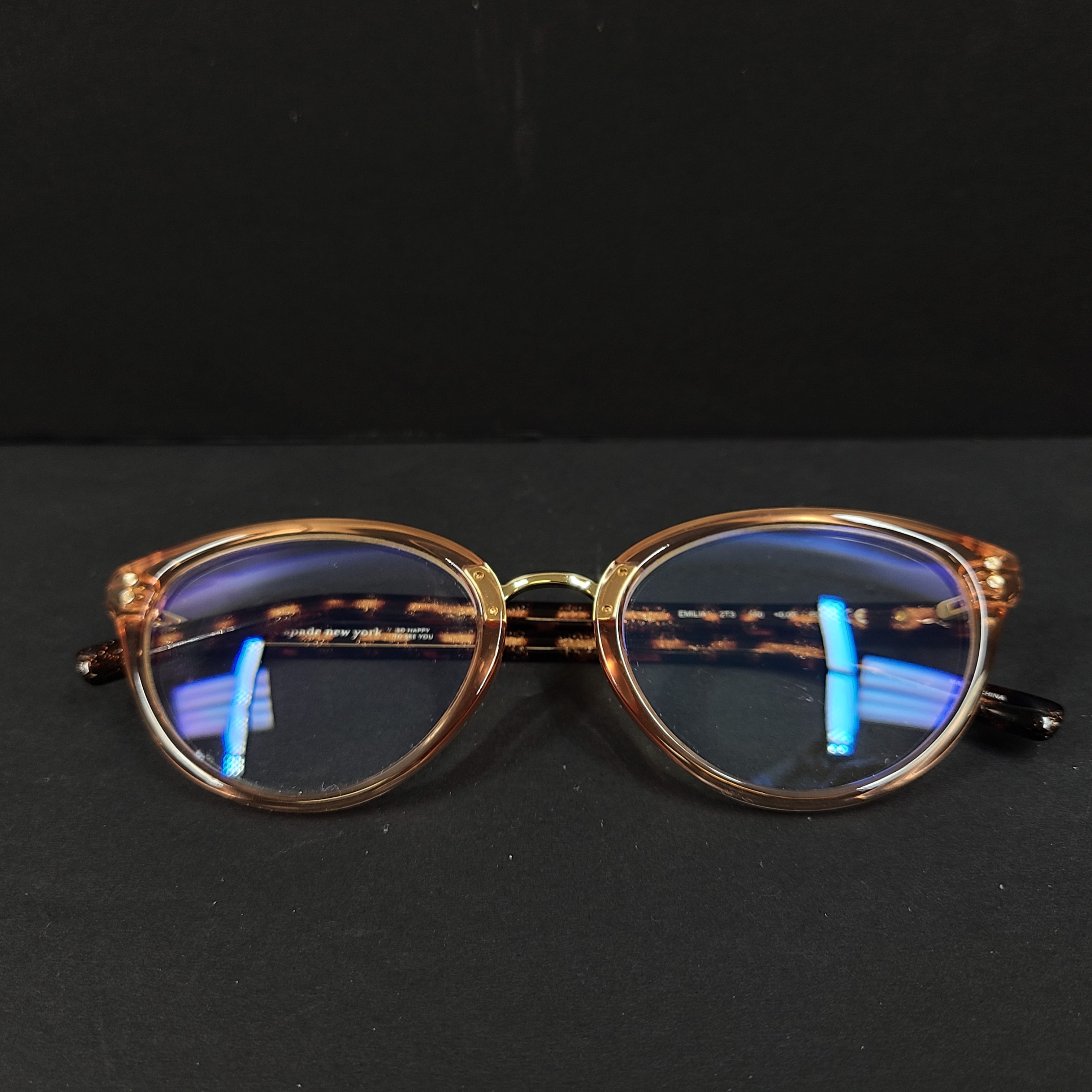 Kate Spade Emilia eyeglasses 2T3 140 in tortoise and peach with a branded arm inscription.