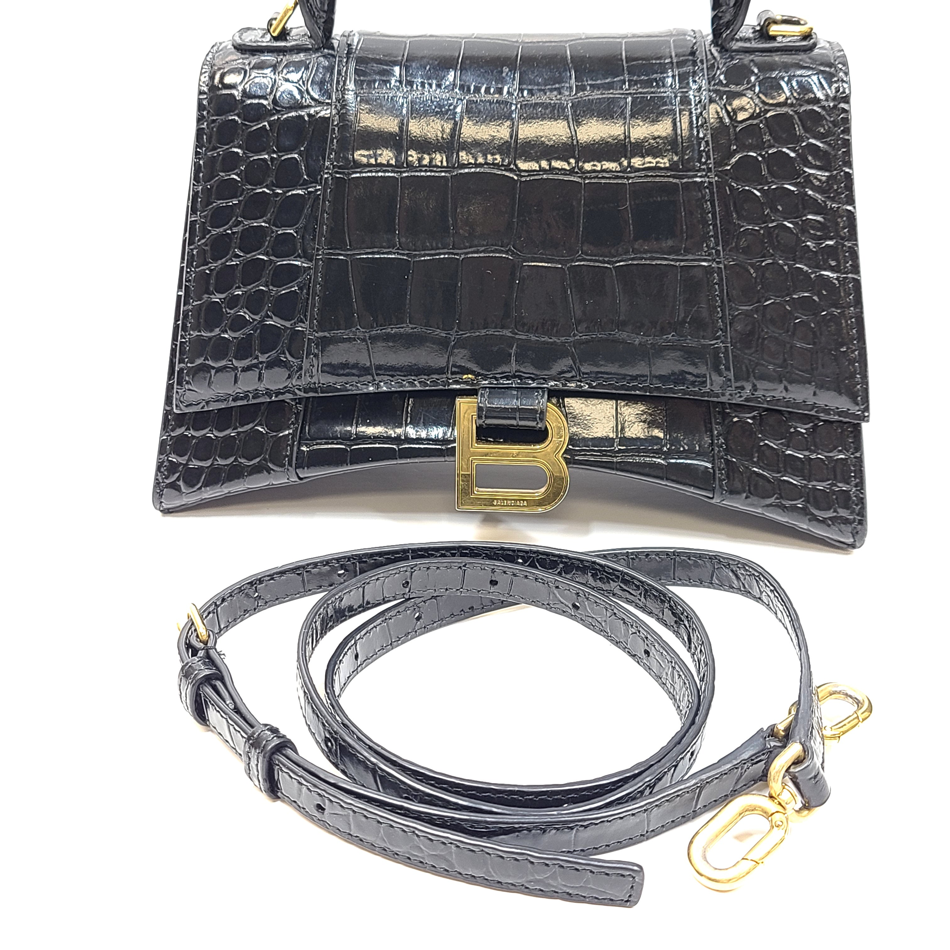 Balenciaga crocodile-embossed black leather handbag with branded buckle and detachable strap.
