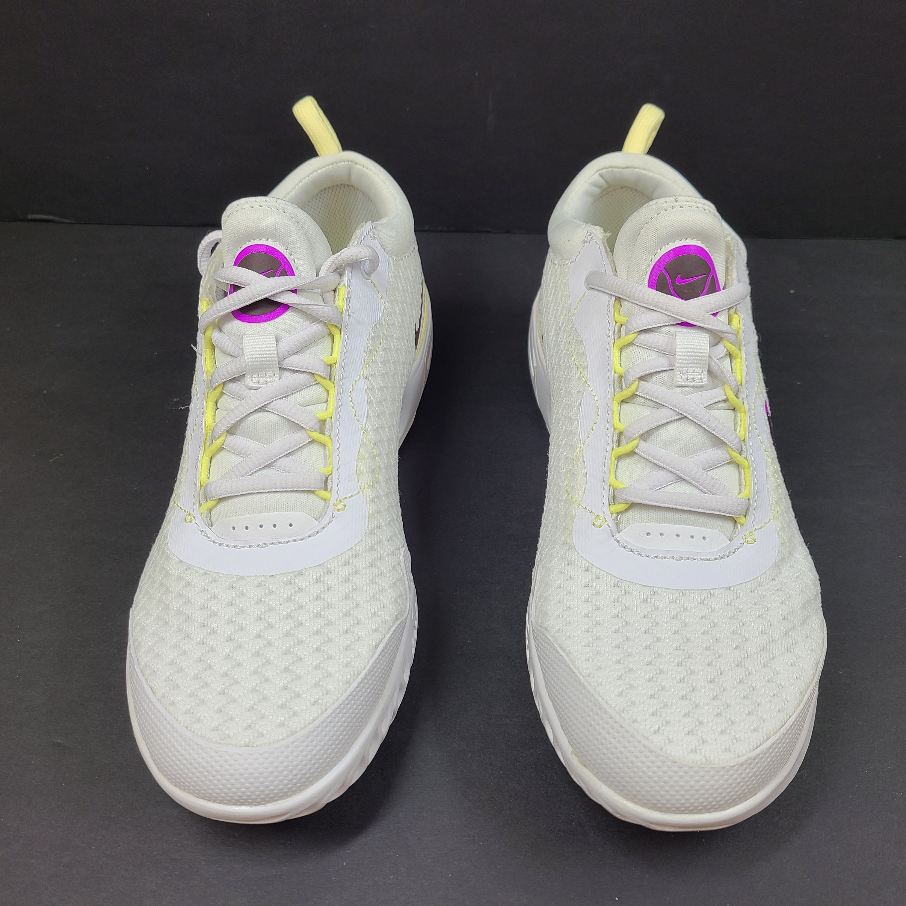 NikeCourt Air Zoom Pro DV3285-101 women's tennis shoes in white, purple, and yellow with a low-profile performance design.