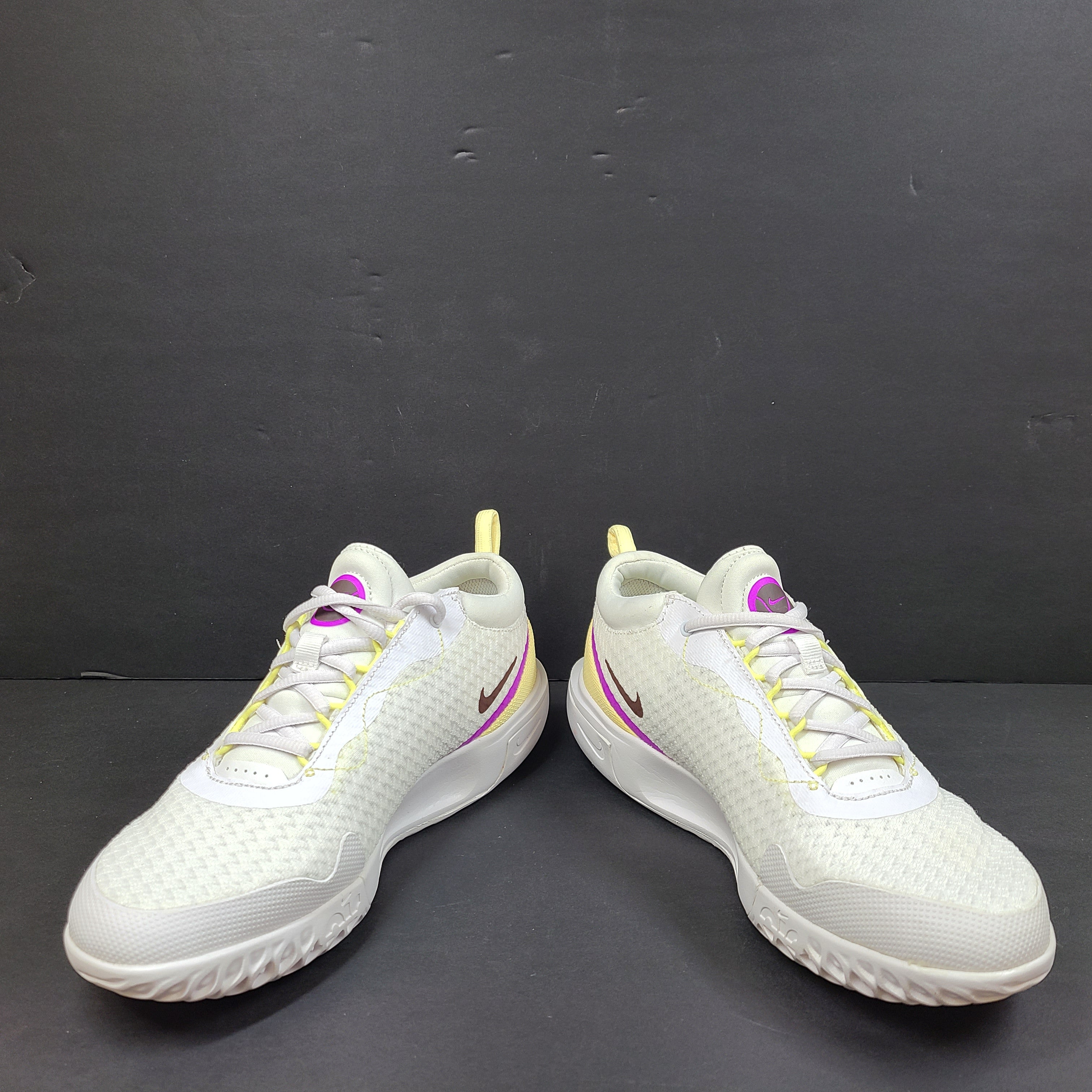 NikeCourt Air Zoom Pro DV3285-101 women's tennis shoes in white, purple, and yellow with a low-profile performance design.