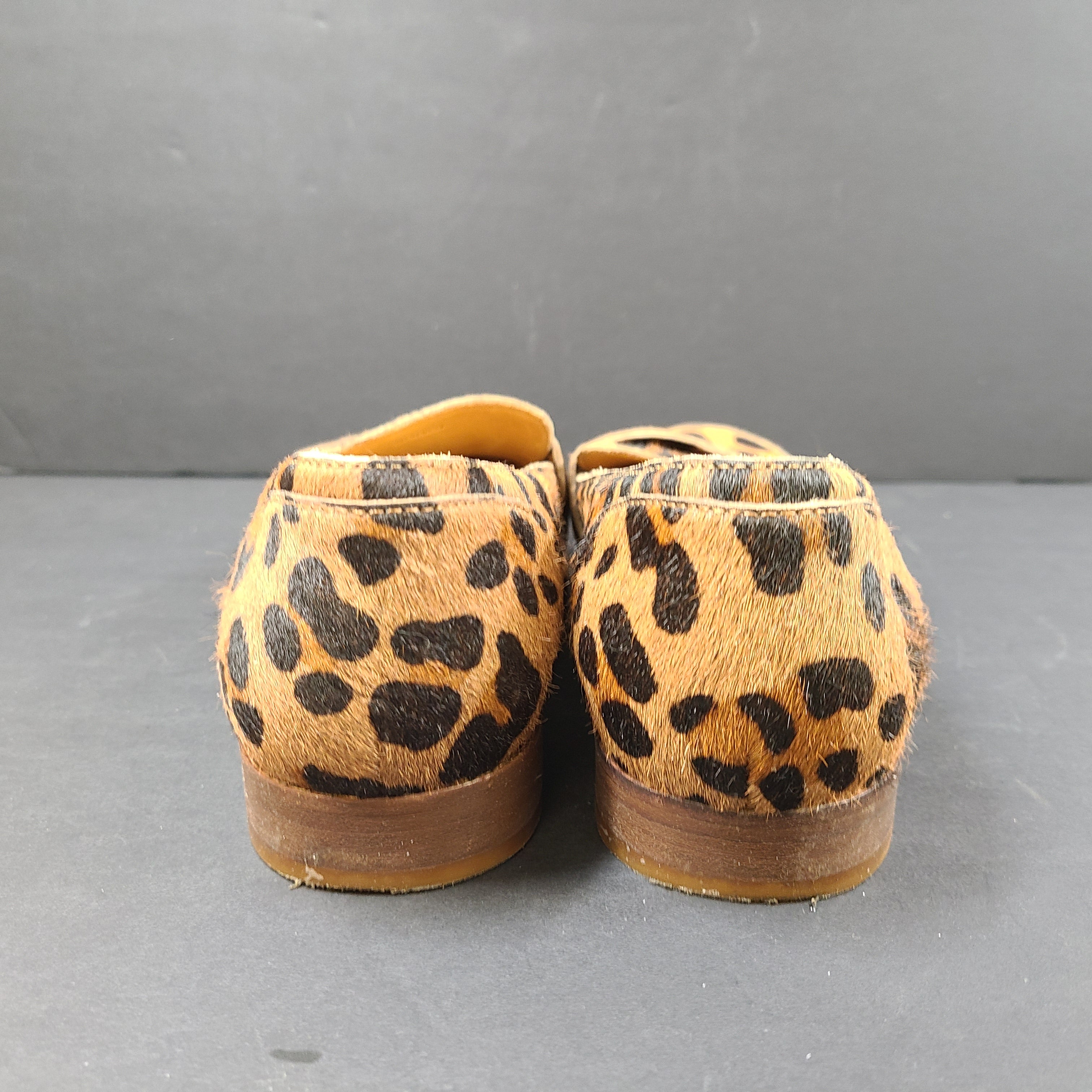 Leopard-print Sézane loafers feature a low profile, branded insole reading "SOULIERS SÉZANE" and a sole stamped "made in Portugal" and 39.