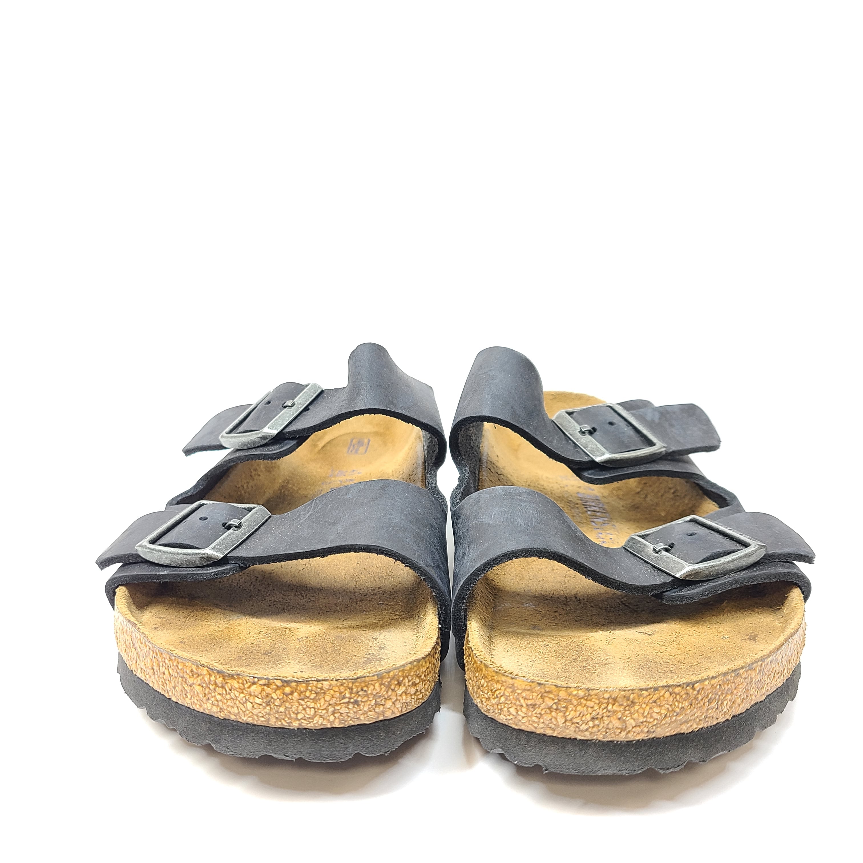 Birkenstock Arizona two-strap black sandals, size 41, with worn footbed and intact straps and soles.
