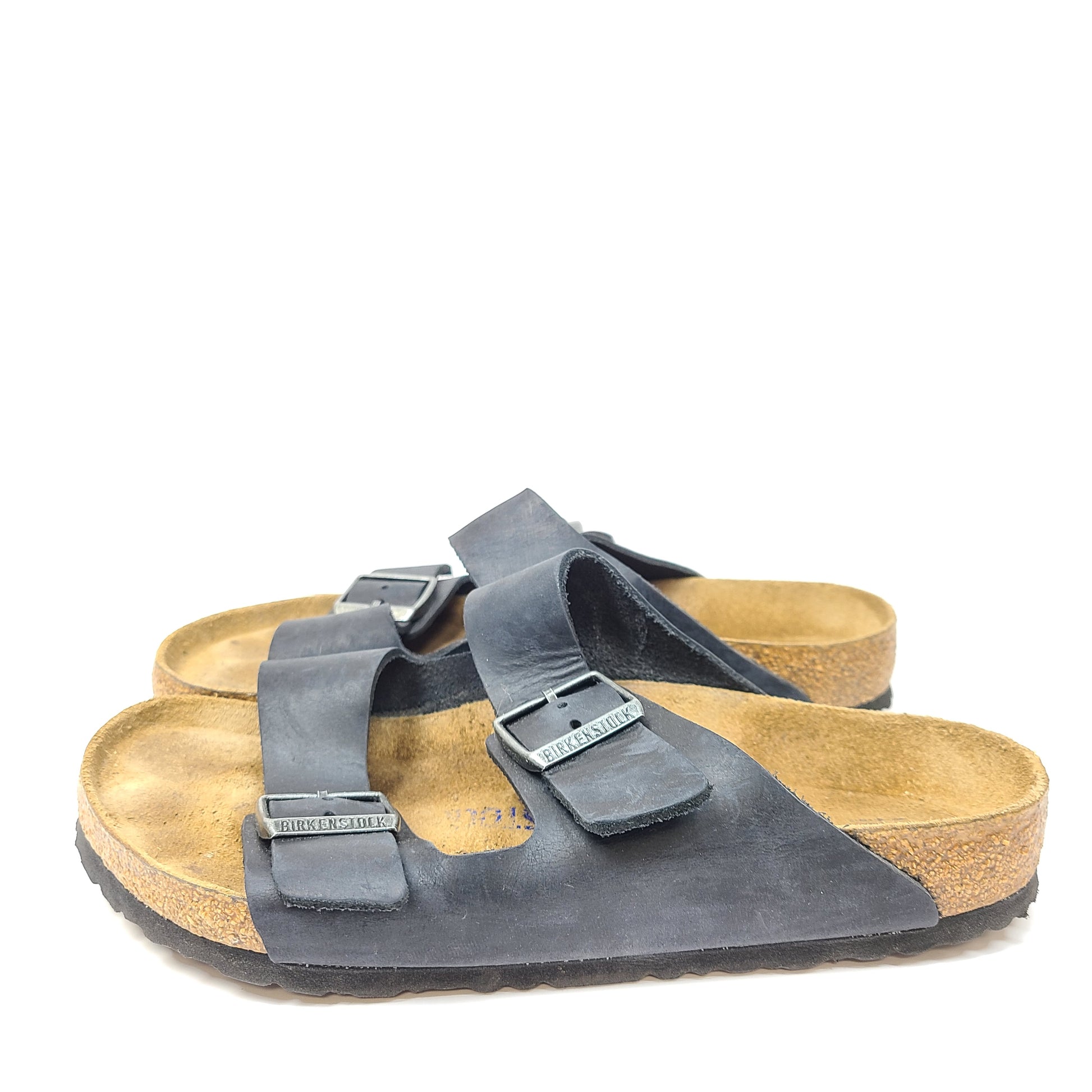 Birkenstock Arizona two-strap black sandals, size 41, with worn footbed and intact straps and soles.