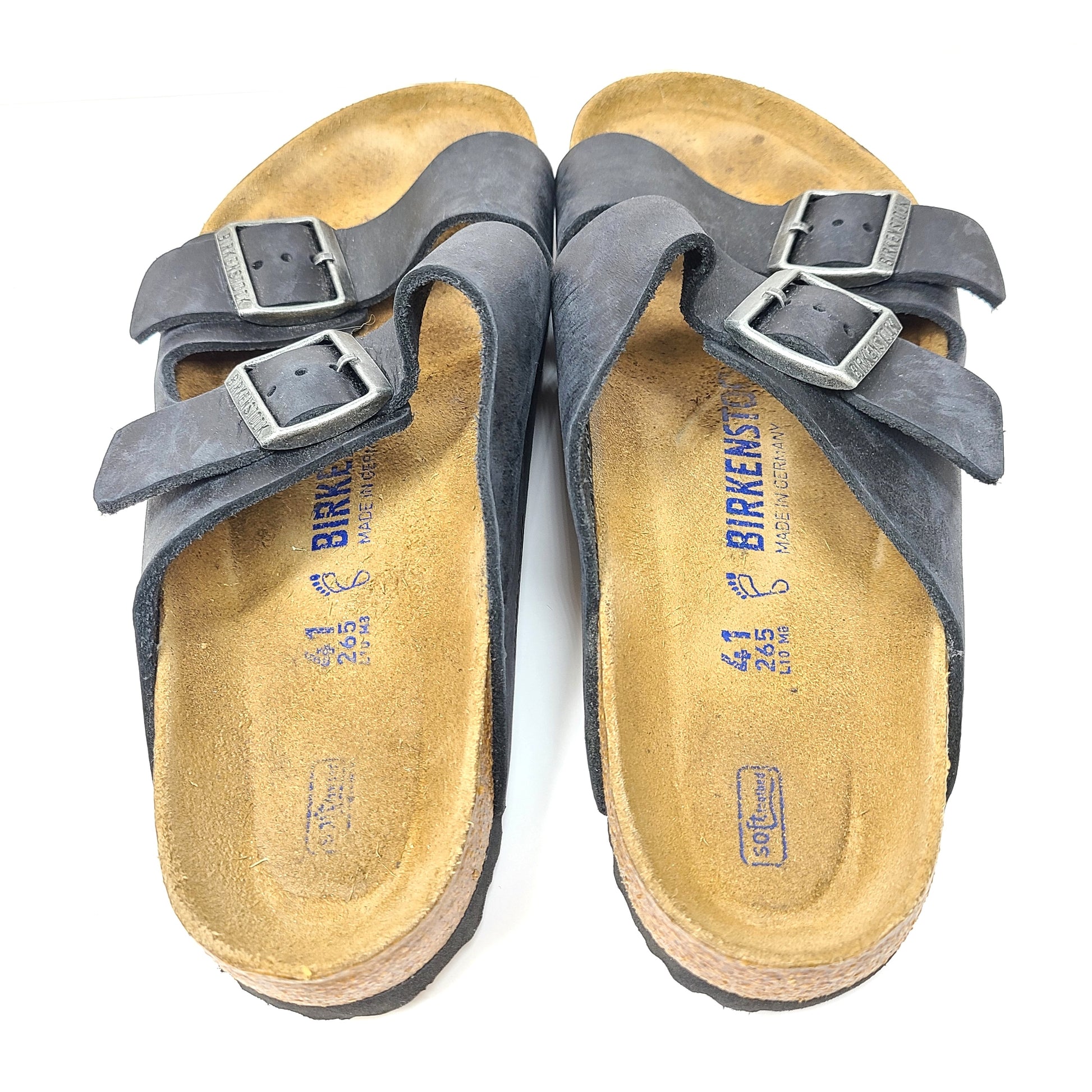 Birkenstock Arizona two-strap black sandals, size 41, with worn footbed and intact straps and soles.