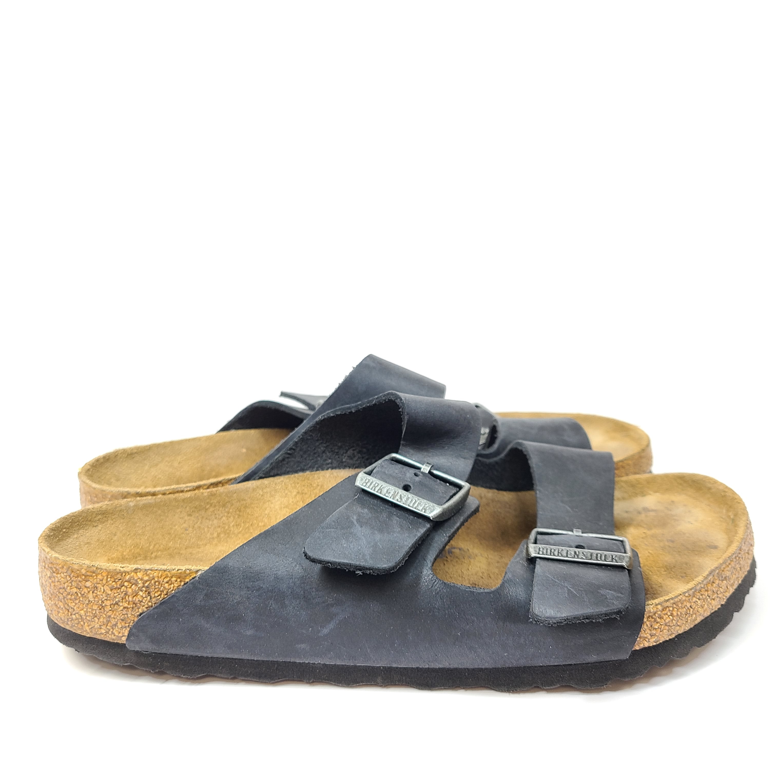 Birkenstock Arizona two-strap black sandals, size 41, with worn footbed and intact straps and soles.