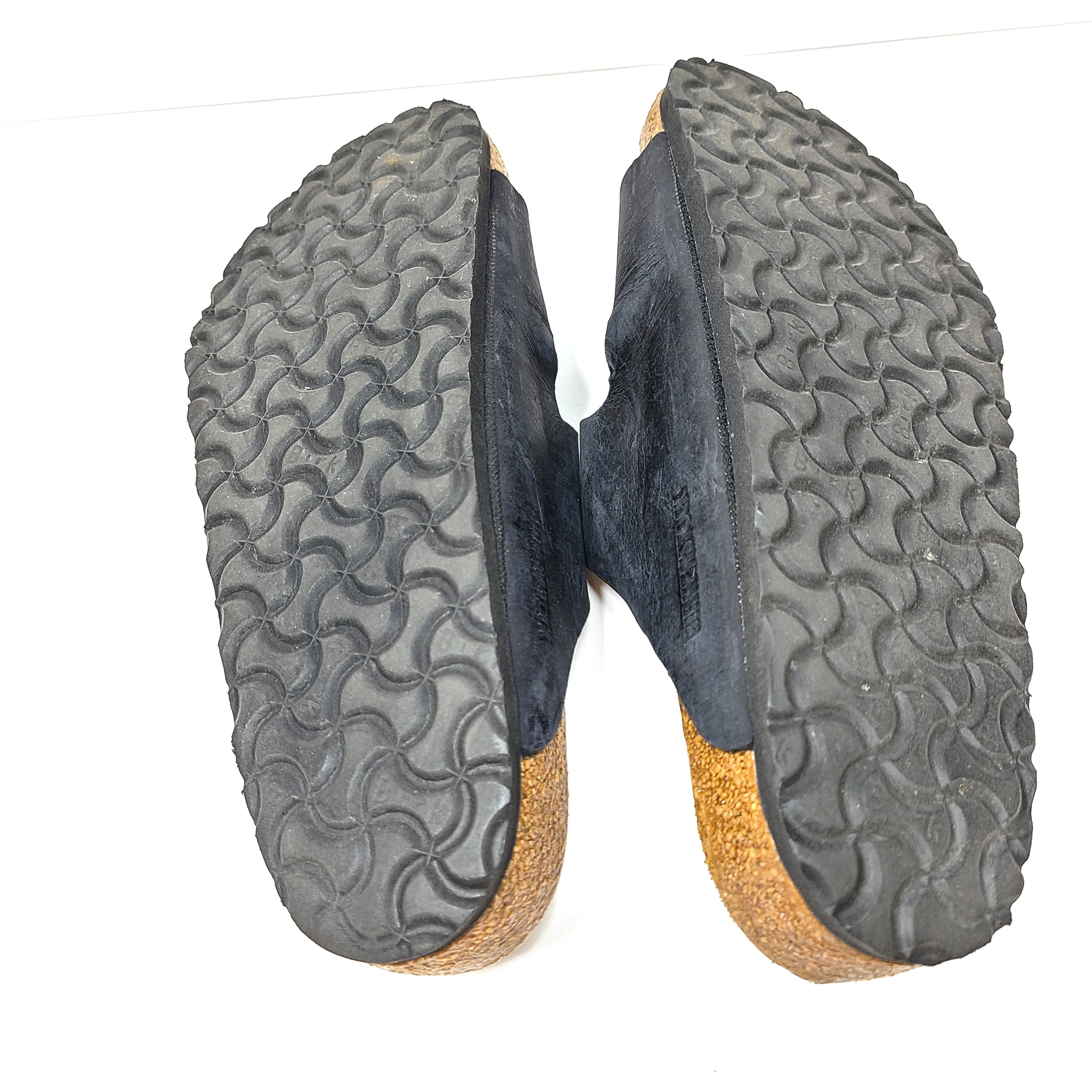 Birkenstock Arizona two-strap black sandals, size 41, with worn footbed and intact straps and soles.