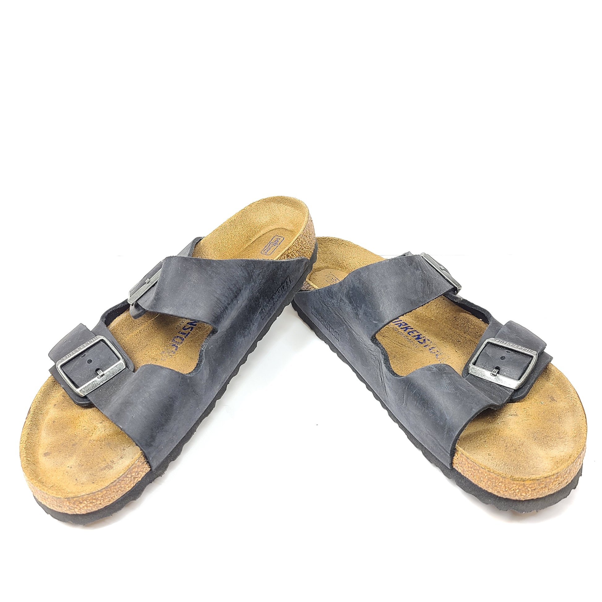 Birkenstock Arizona two-strap black sandals, size 41, with worn footbed and intact straps and soles.