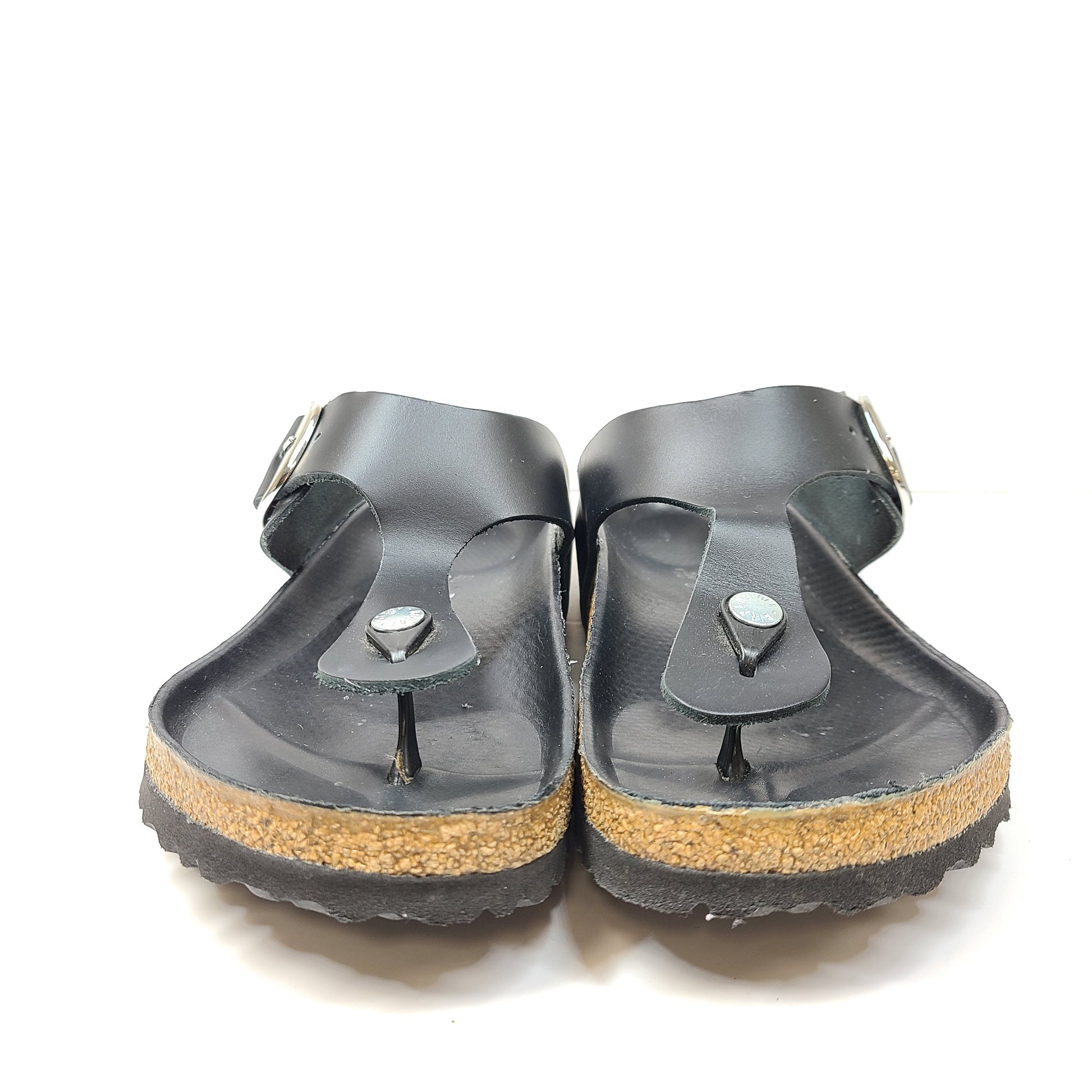Black Birkenstock sandals size 40 with adjustable straps and contoured cork footbed for lasting comfort.