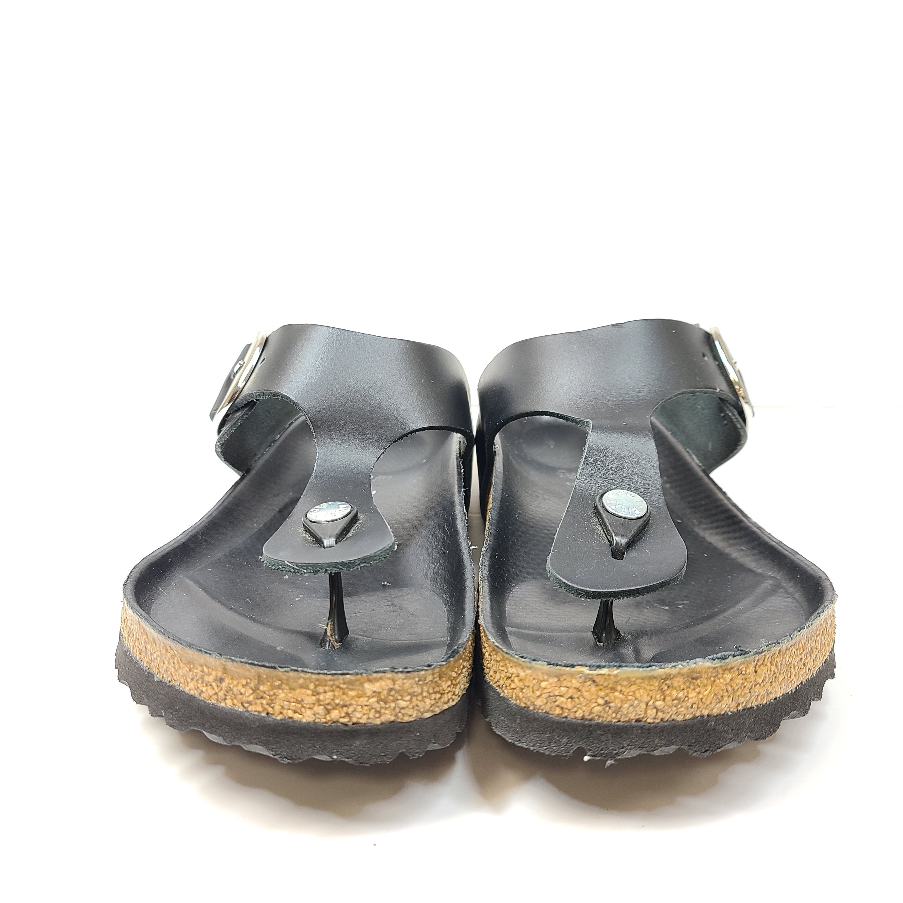 Black Birkenstock sandals size 40 with adjustable straps and contoured cork footbed for lasting comfort.