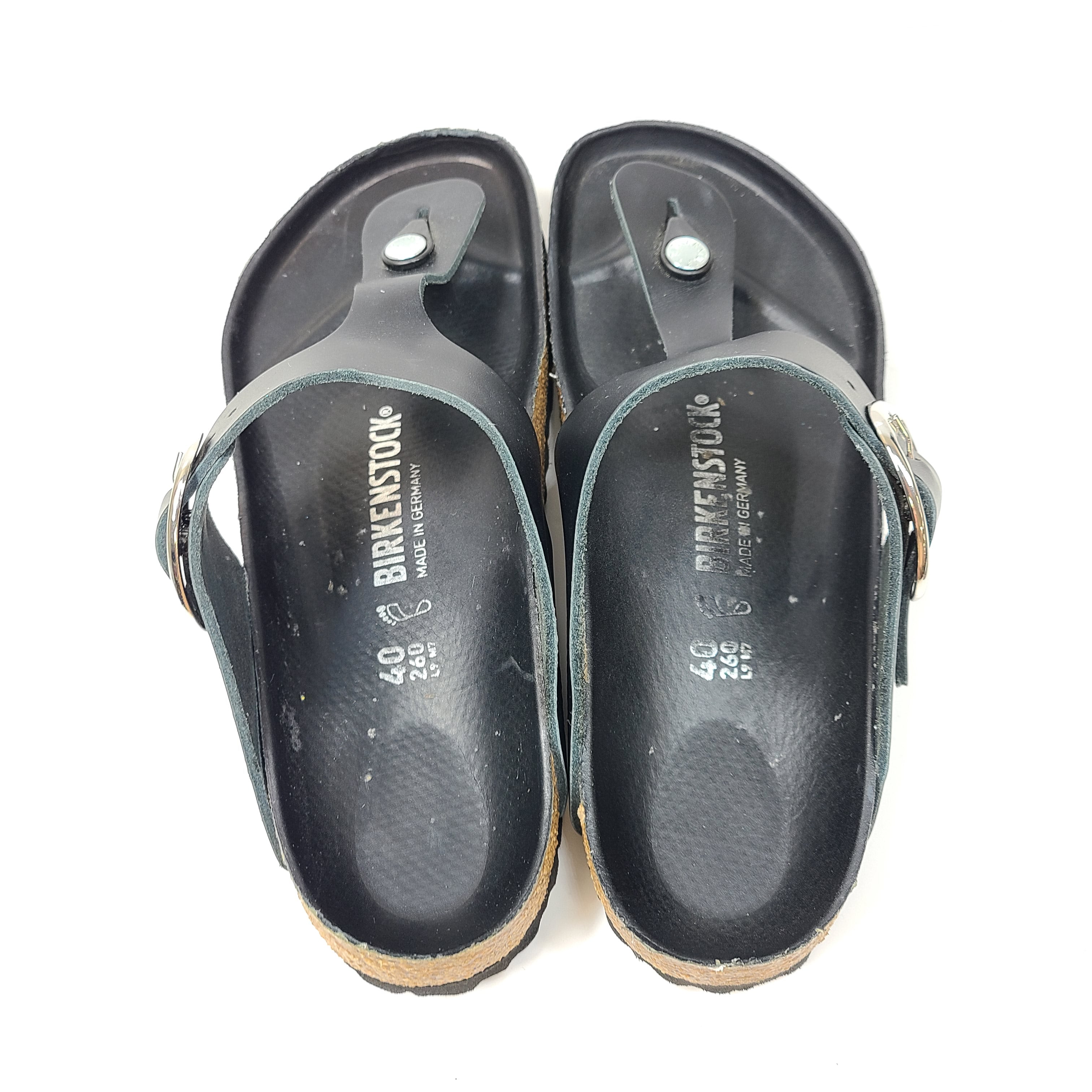 Black Birkenstock sandals size 40 with adjustable straps and contoured cork footbed for lasting comfort.