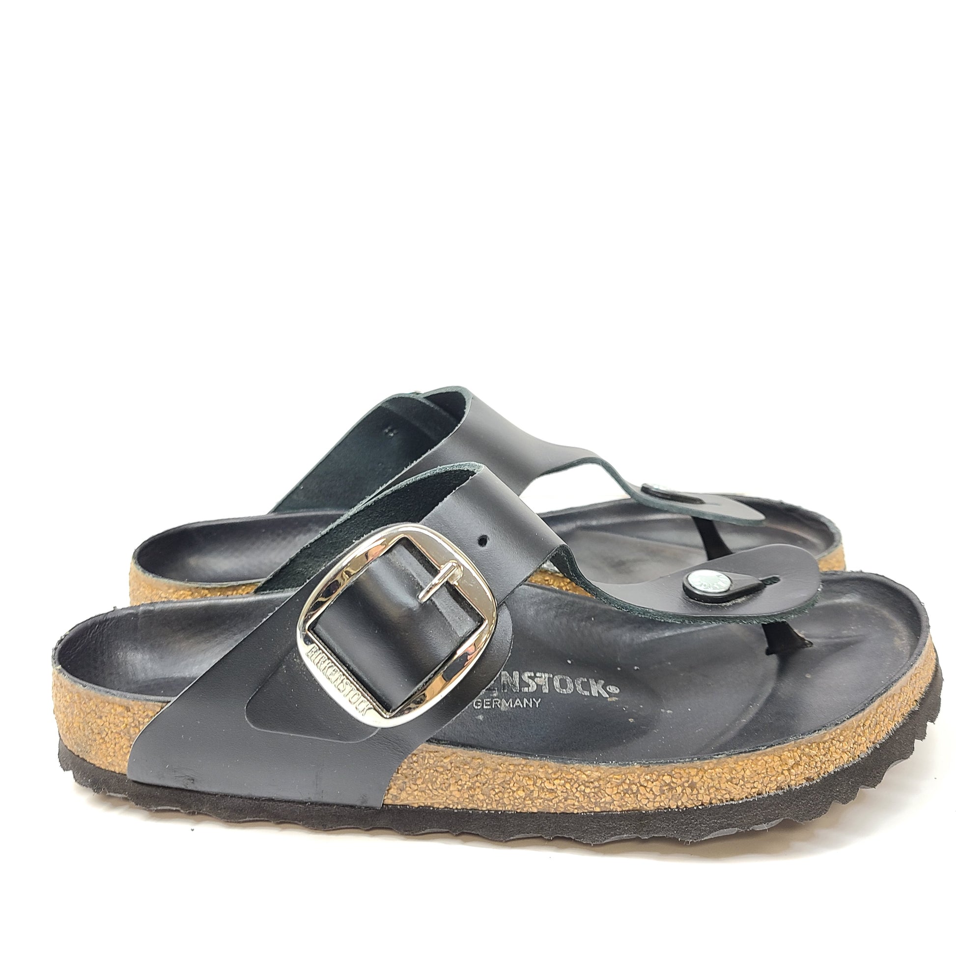 Black Birkenstock sandals size 40 with adjustable straps and contoured cork footbed for lasting comfort.
