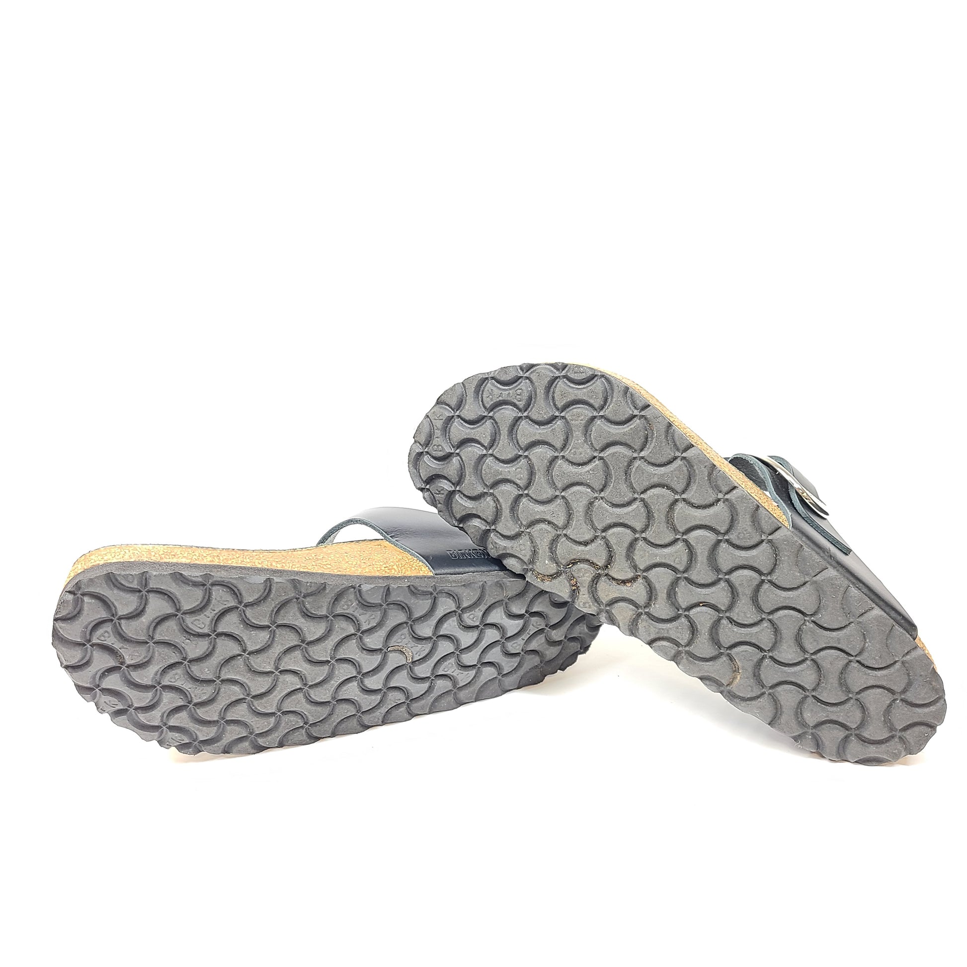 Black Birkenstock sandals size 40 with adjustable straps and contoured cork footbed for lasting comfort.