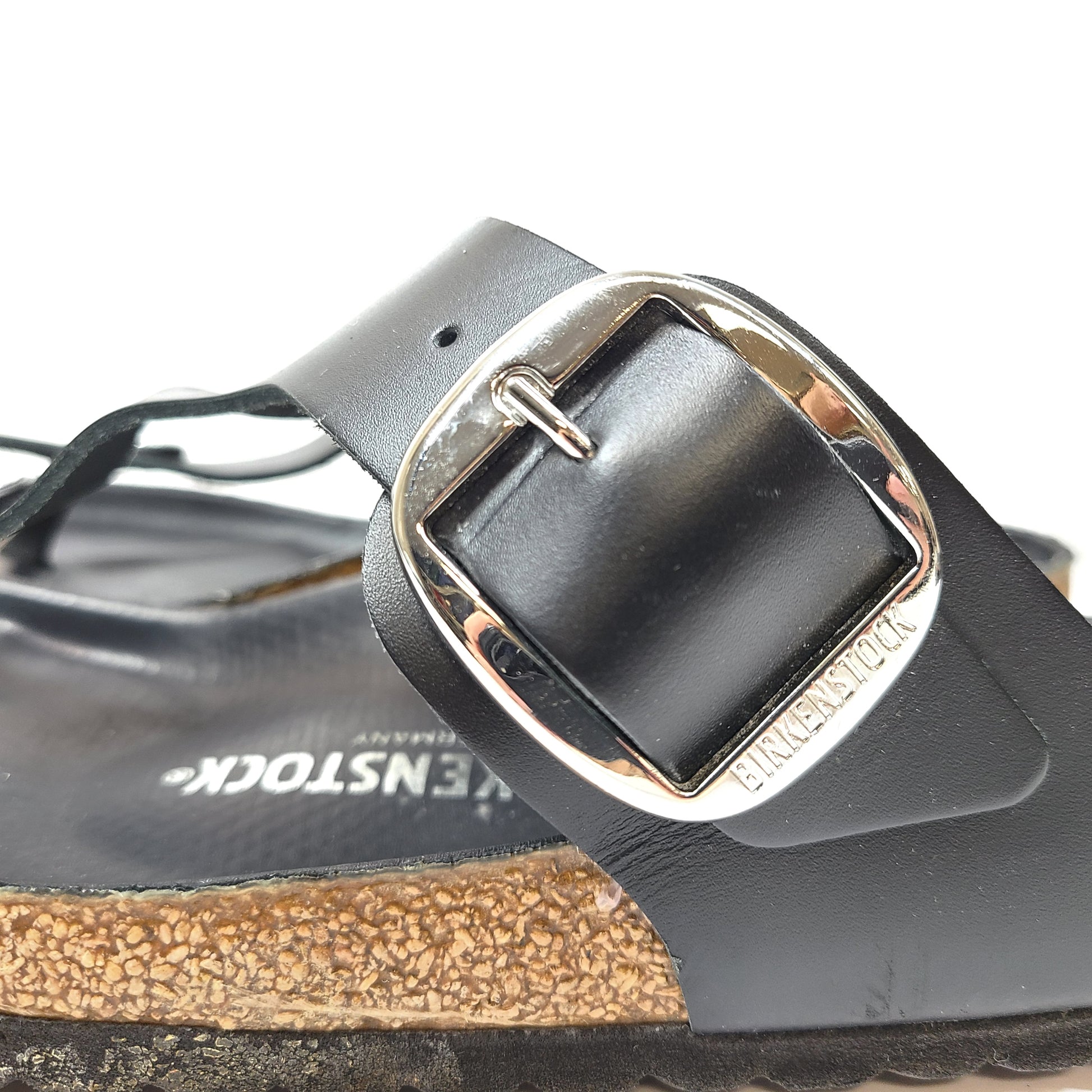 Black Birkenstock sandals size 40 with adjustable straps and contoured cork footbed for lasting comfort.