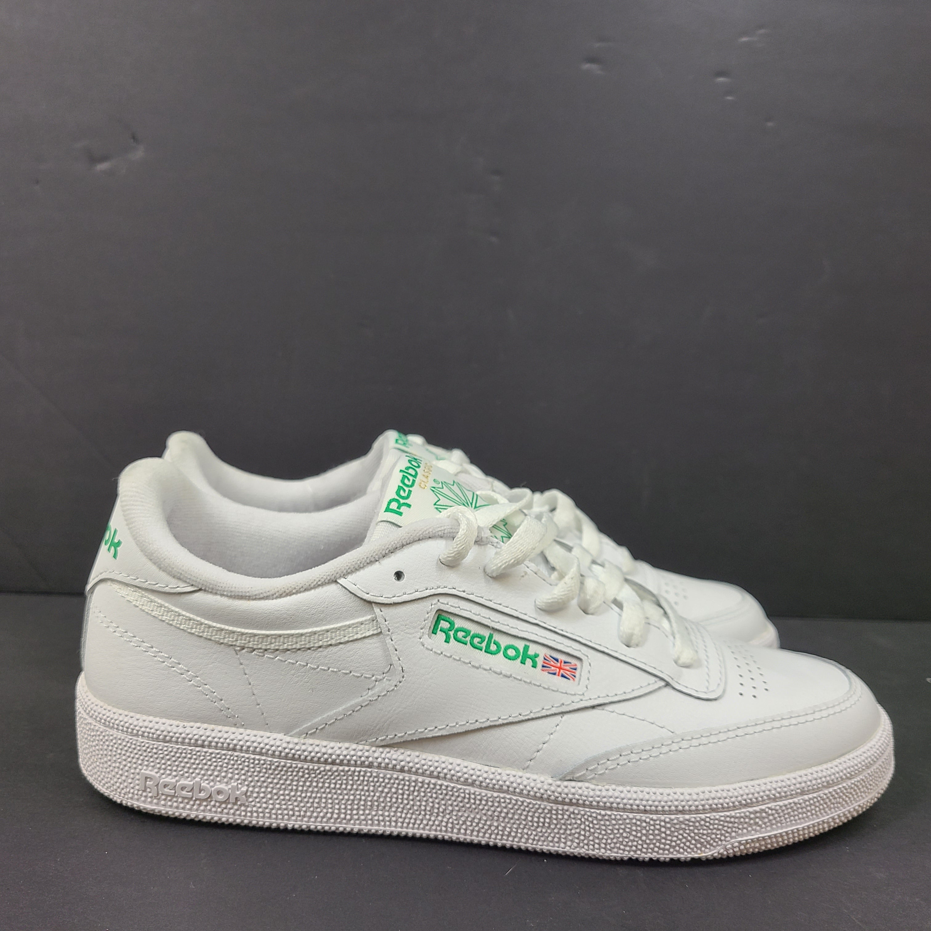 White Reebok Classic low-top sneakers in US size 8 with minimal wear and slight interior lining markings.