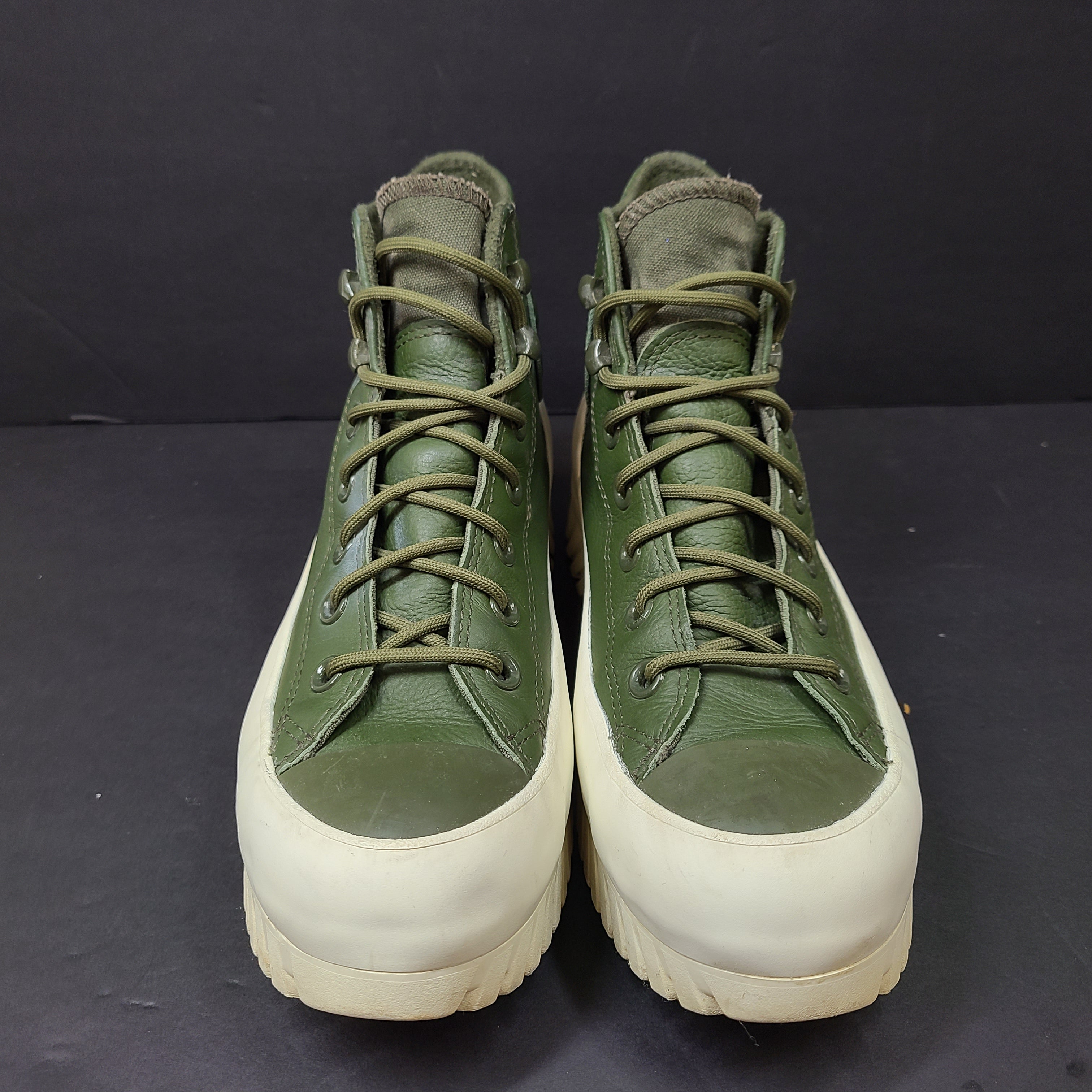 Olive and white Converse All Star Counter Climate waterproof boots with lugged rubber outsoles and leather upper.