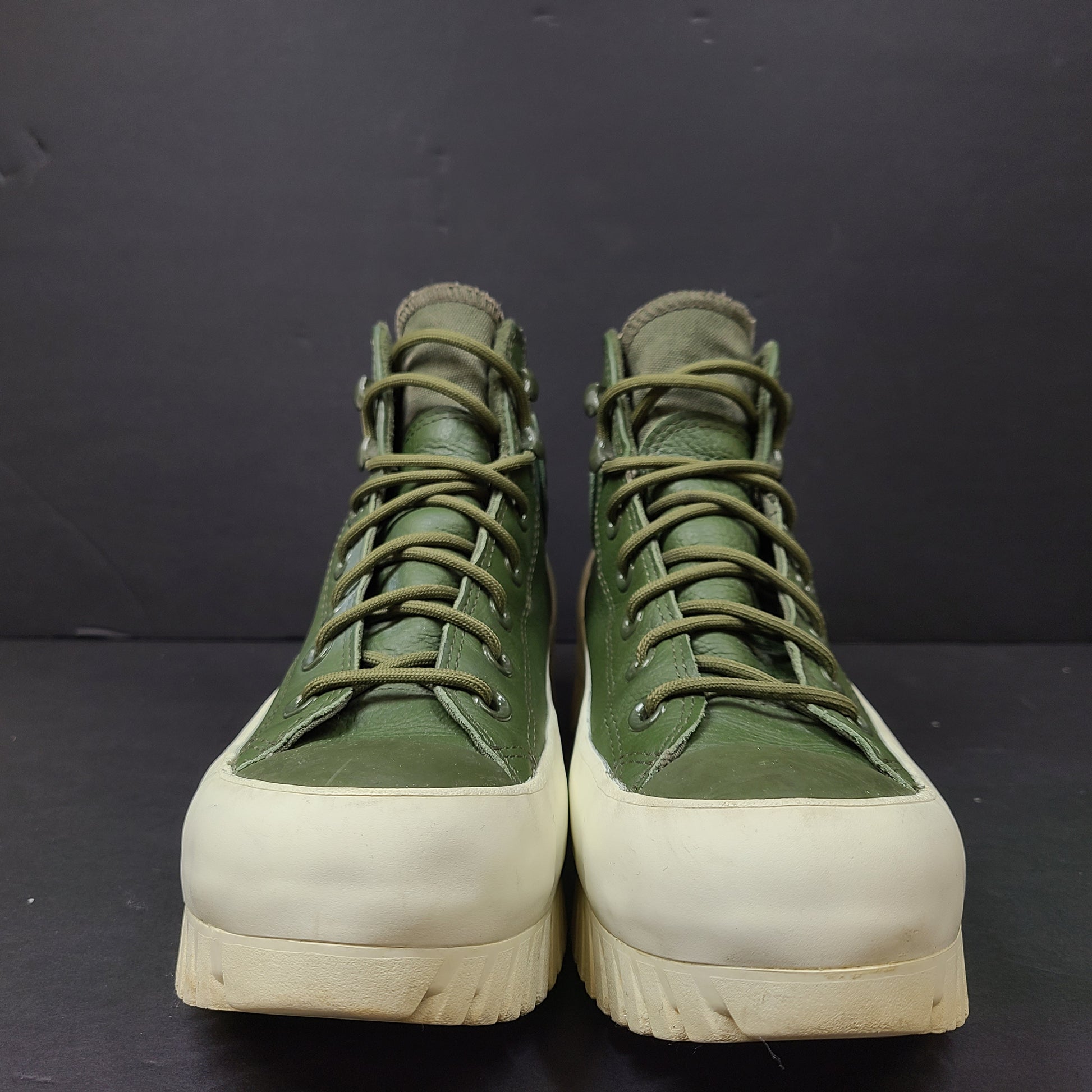 Olive and white Converse All Star Counter Climate waterproof boots with lugged rubber outsoles and leather upper.