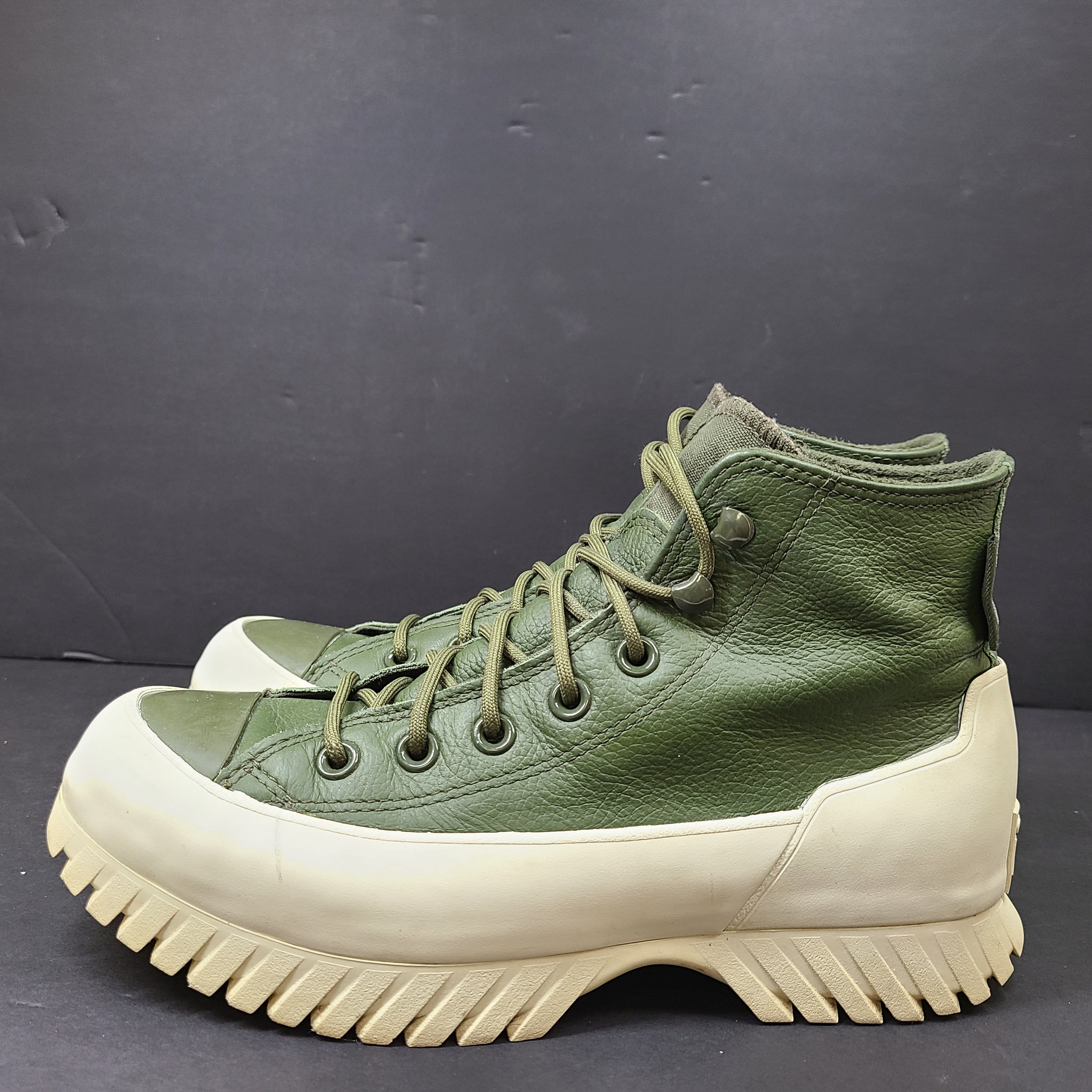 Olive and white Converse All Star Counter Climate waterproof boots with lugged rubber outsoles and leather upper.