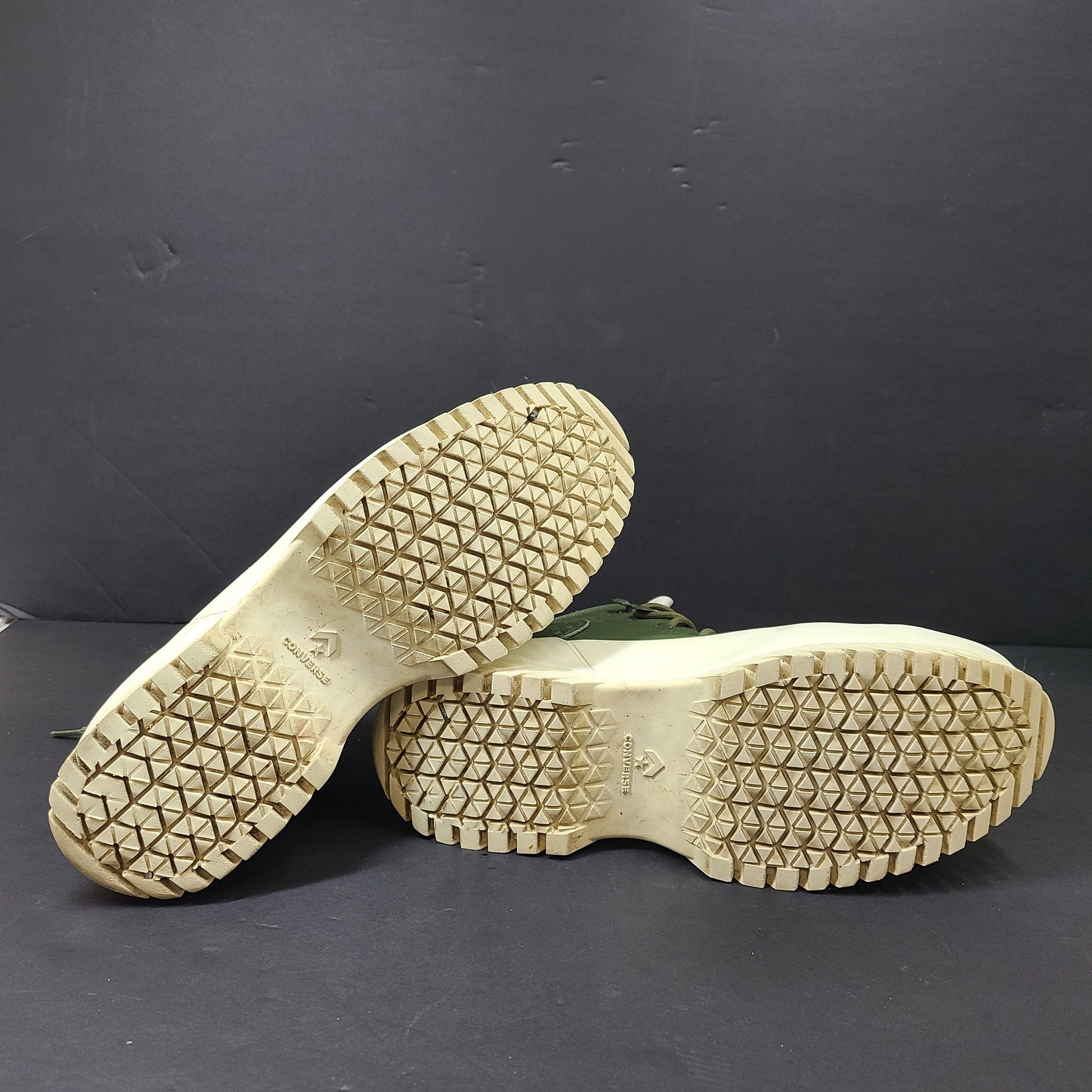 Olive and white Converse All Star Counter Climate waterproof boots with lugged rubber outsoles and leather upper.