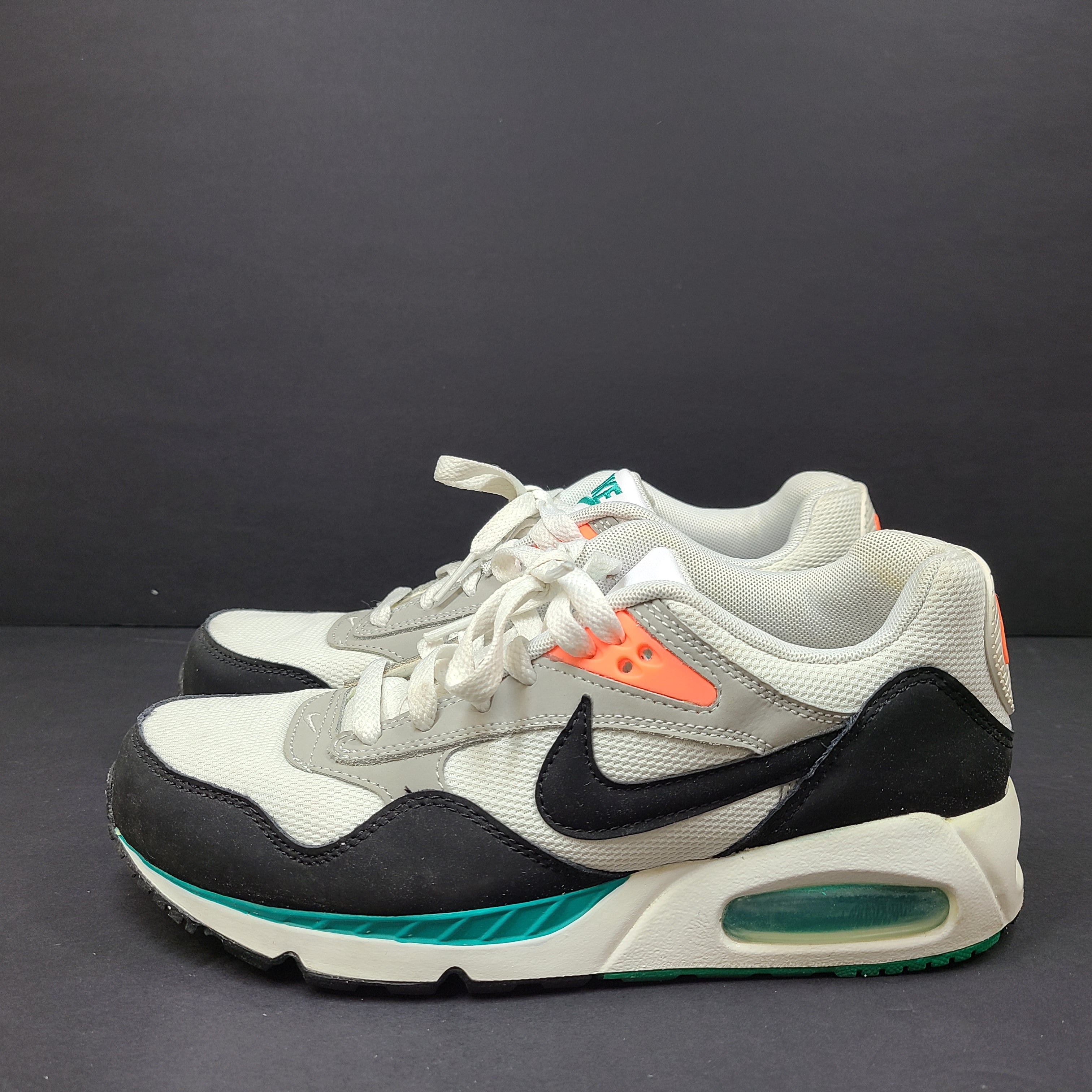 Nike Air Max Correlate in white, black and orange with Air Max cushioning and a low-top silhouette.