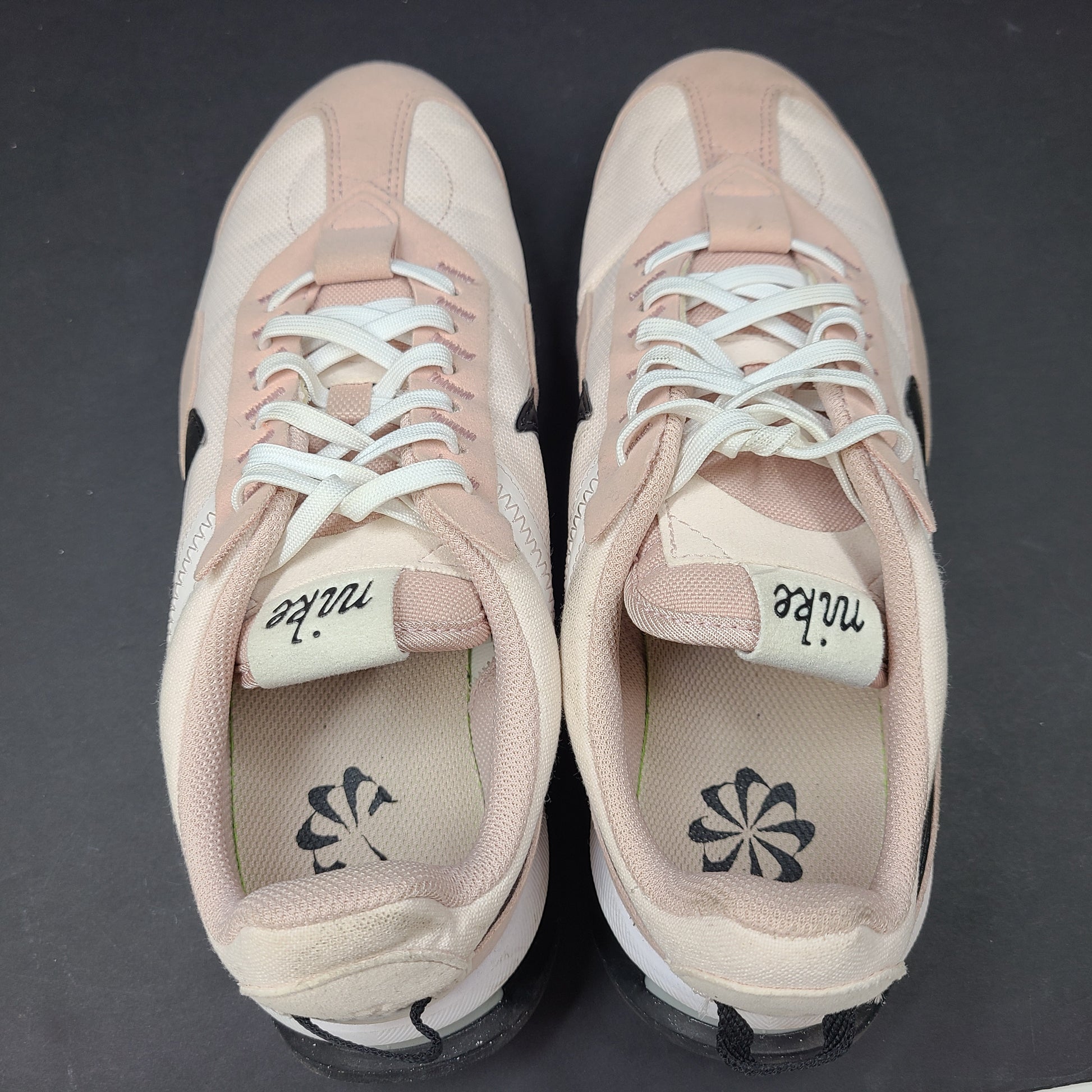 Nike Air Max Pre-Day women's sneaker in beige and black, size US 7.5, model DM8259-600, with wear on the soles.