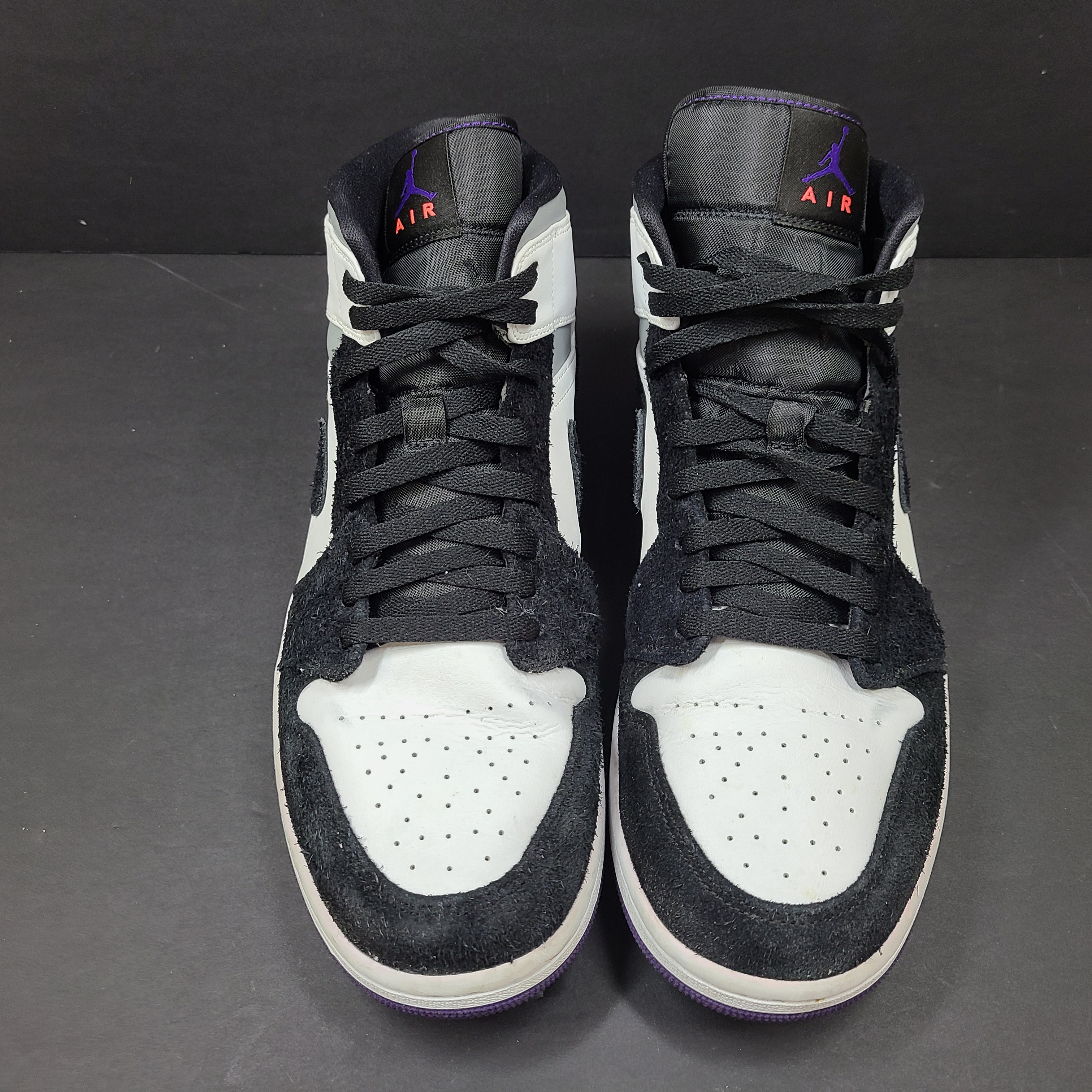 Air Jordan 1 Mid SE Varsity Purple sneakers in black, white, and purple, US size 12.