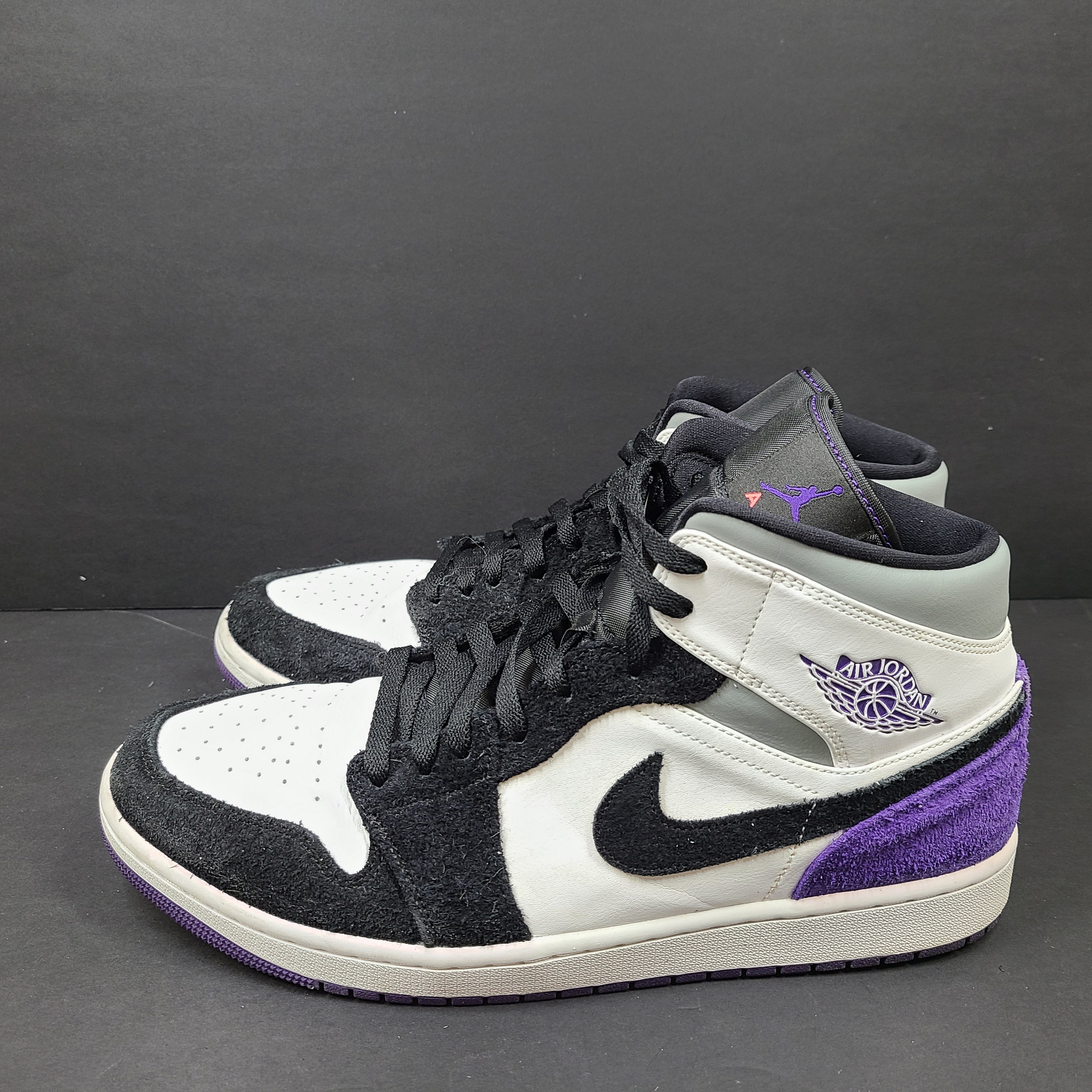 Air Jordan 1 Mid SE Varsity Purple sneakers in black, white, and purple, US size 12.