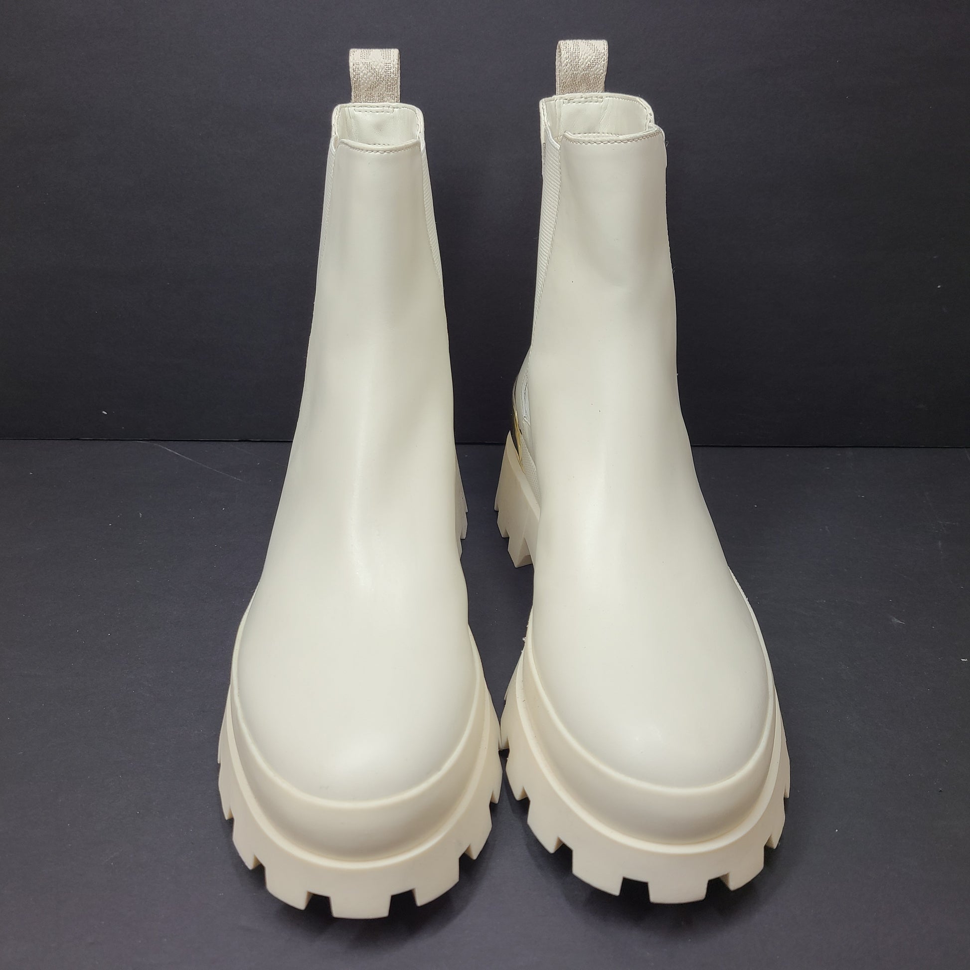 Michael Kors ivory boots size 8M in new, unused condition.