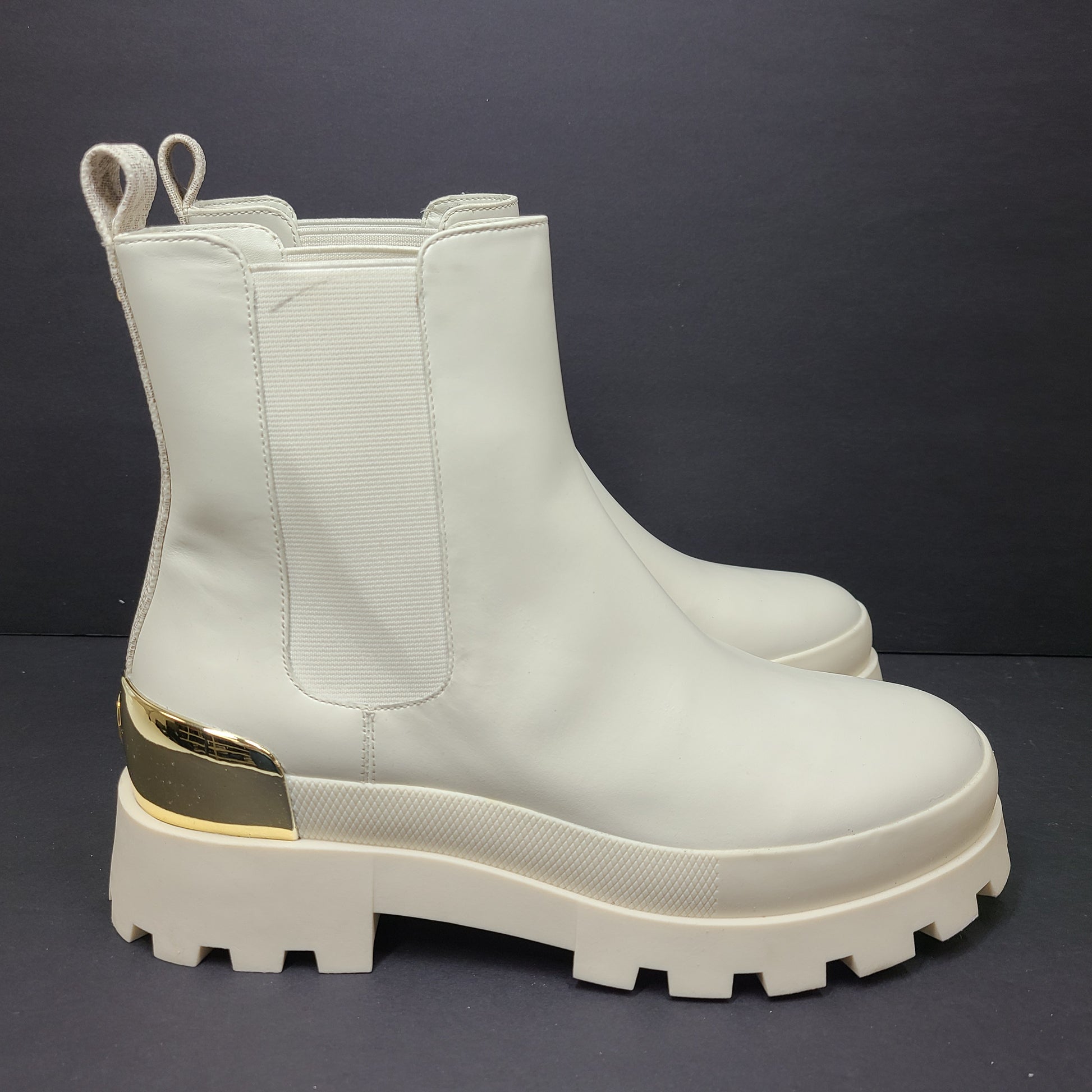 Michael Kors ivory boots size 8M in new, unused condition.