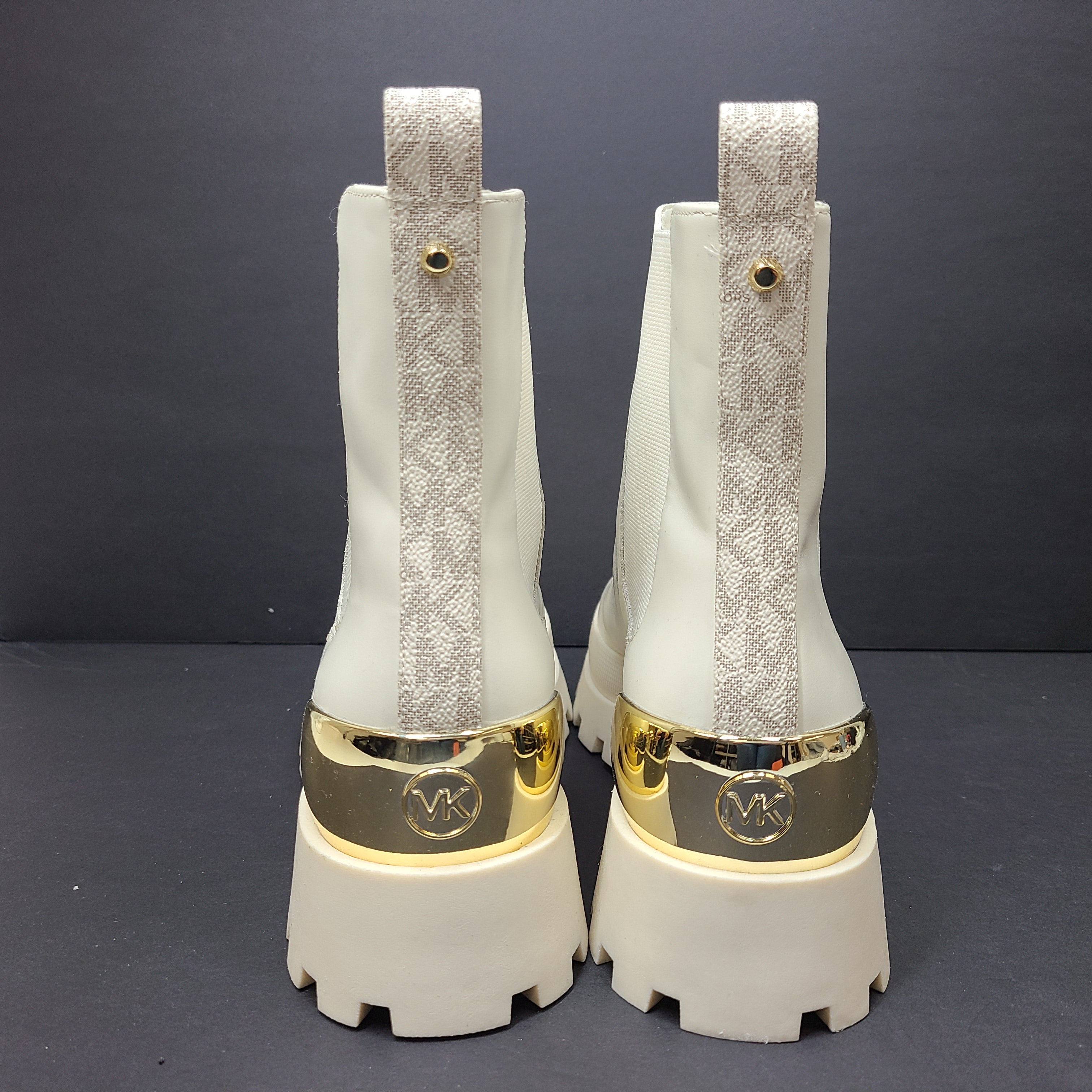 Michael Kors ivory boots size 8M in new, unused condition.