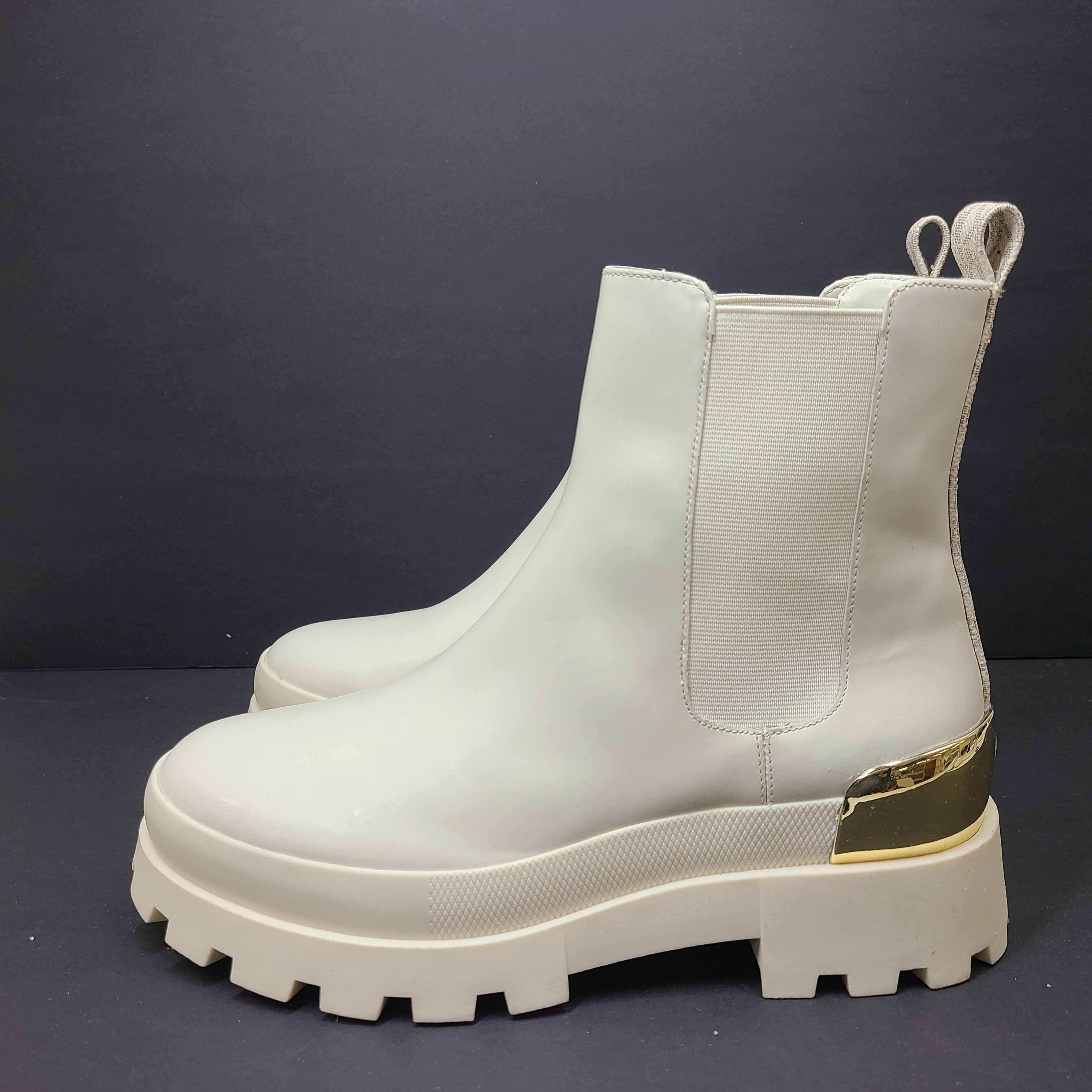 Michael Kors ivory boots size 8M in new, unused condition.