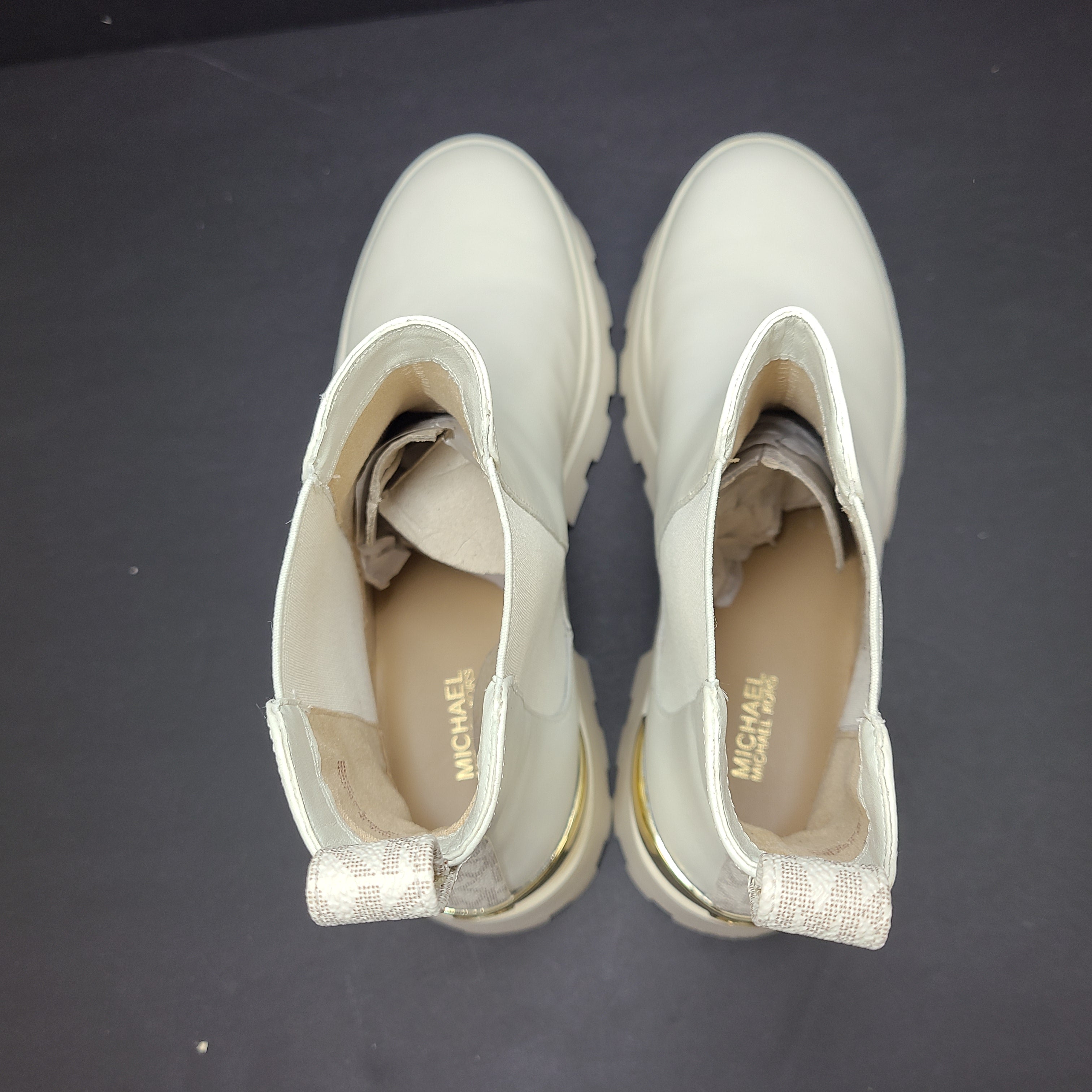 Michael Kors ivory boots size 8M in new, unused condition.