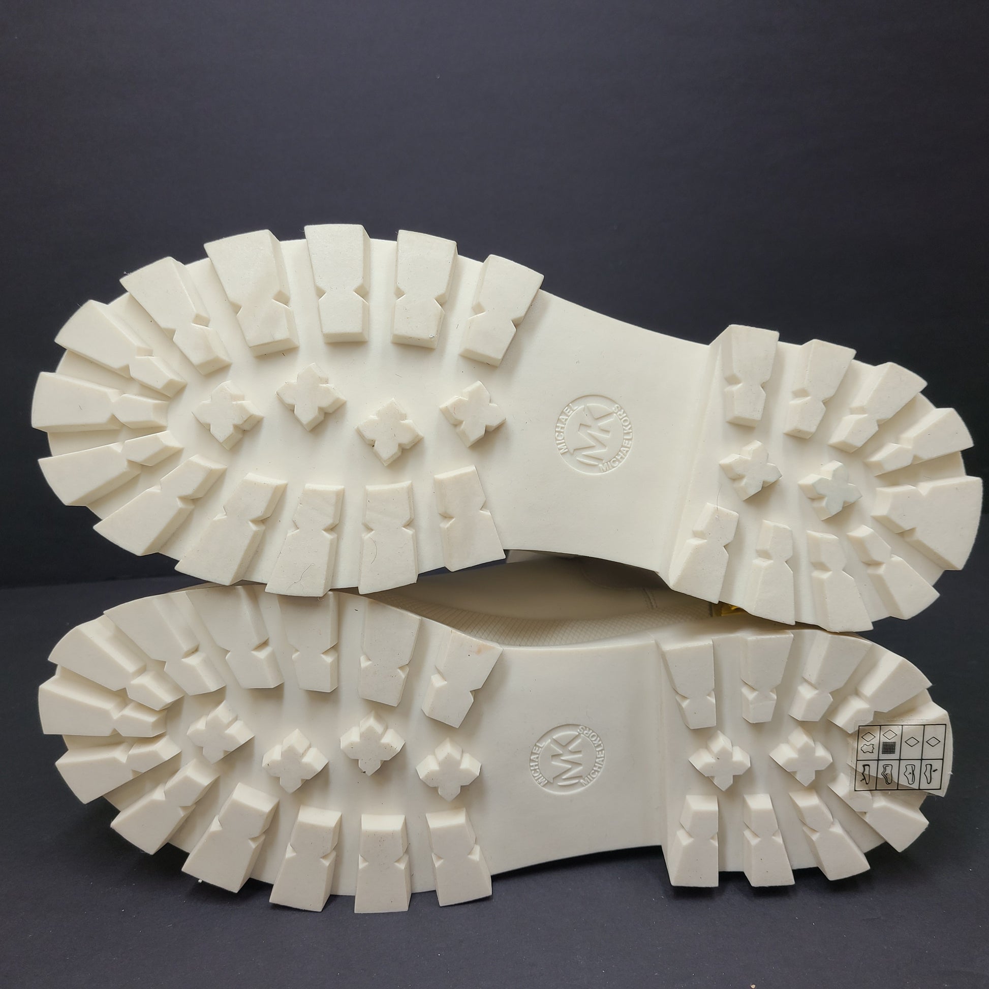 Michael Kors ivory boots size 8M in new, unused condition.