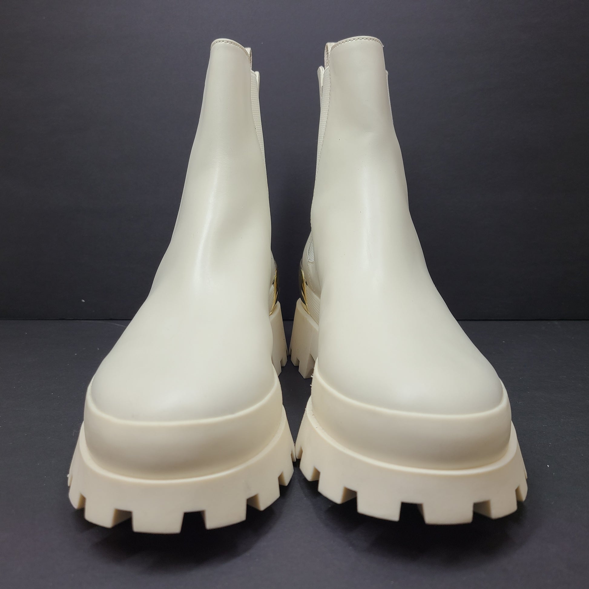 Michael Kors ivory boots size 8M in new, unused condition.