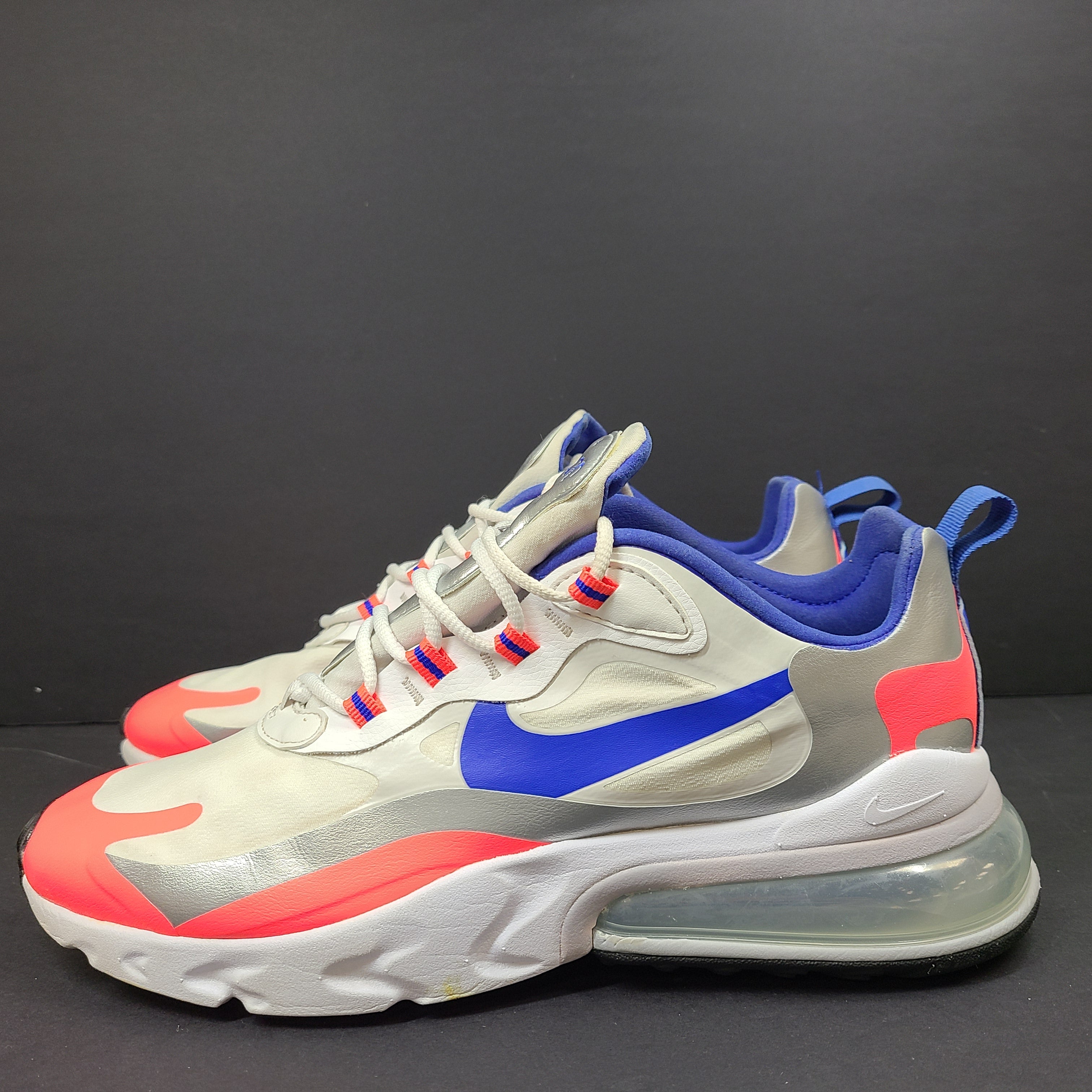 Nike Air Max 270 React US 10.5 in gray, blue and red, pre-owned with light wear.