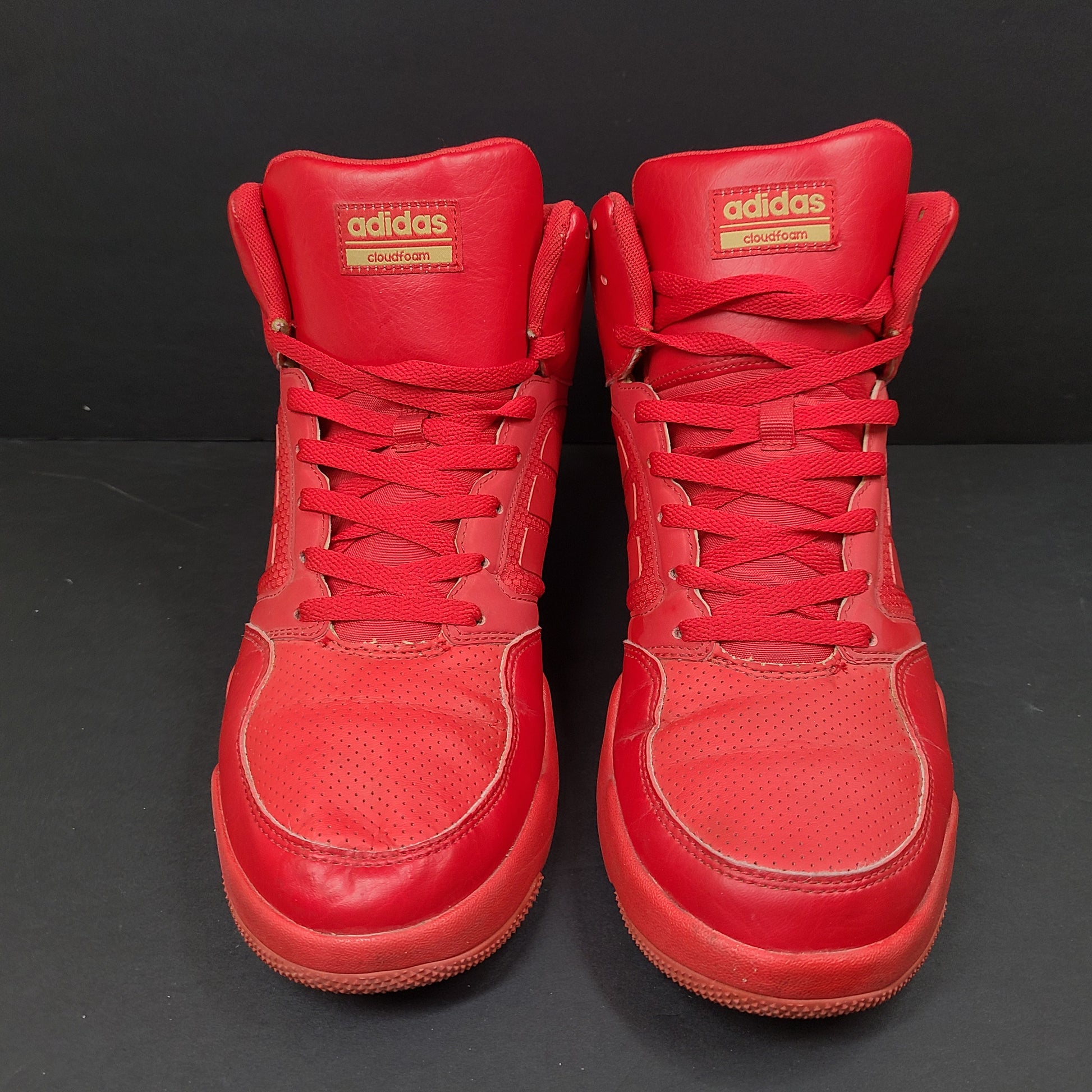 Red Adidas Cloudfoam sneakers size US 8.5 with sole wear and minor creasing.