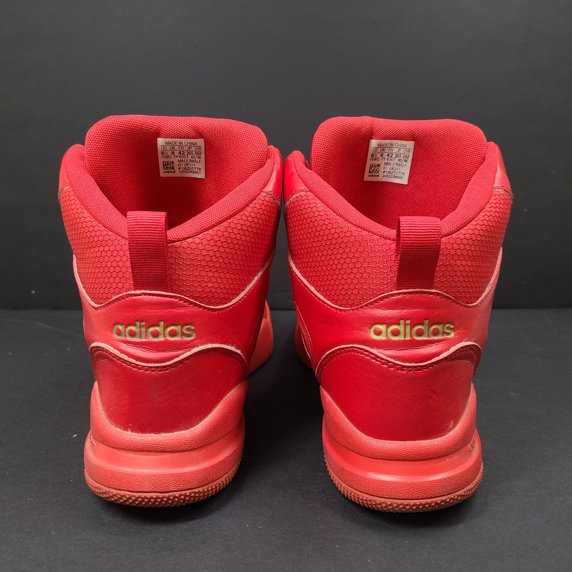 Red Adidas Cloudfoam sneakers size US 8.5 with sole wear and minor creasing.