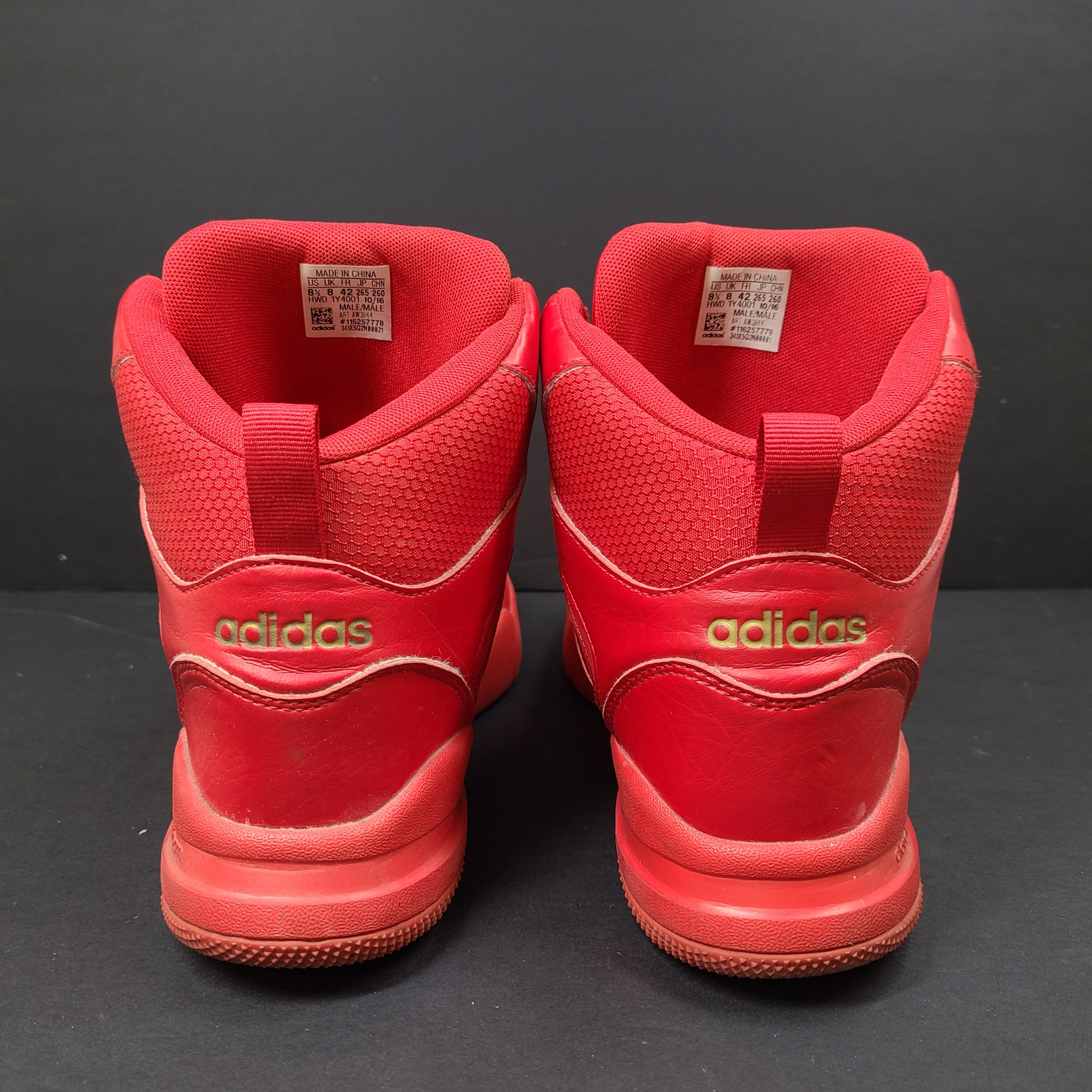 Red Adidas Cloudfoam sneakers size US 8.5 with sole wear and minor creasing.