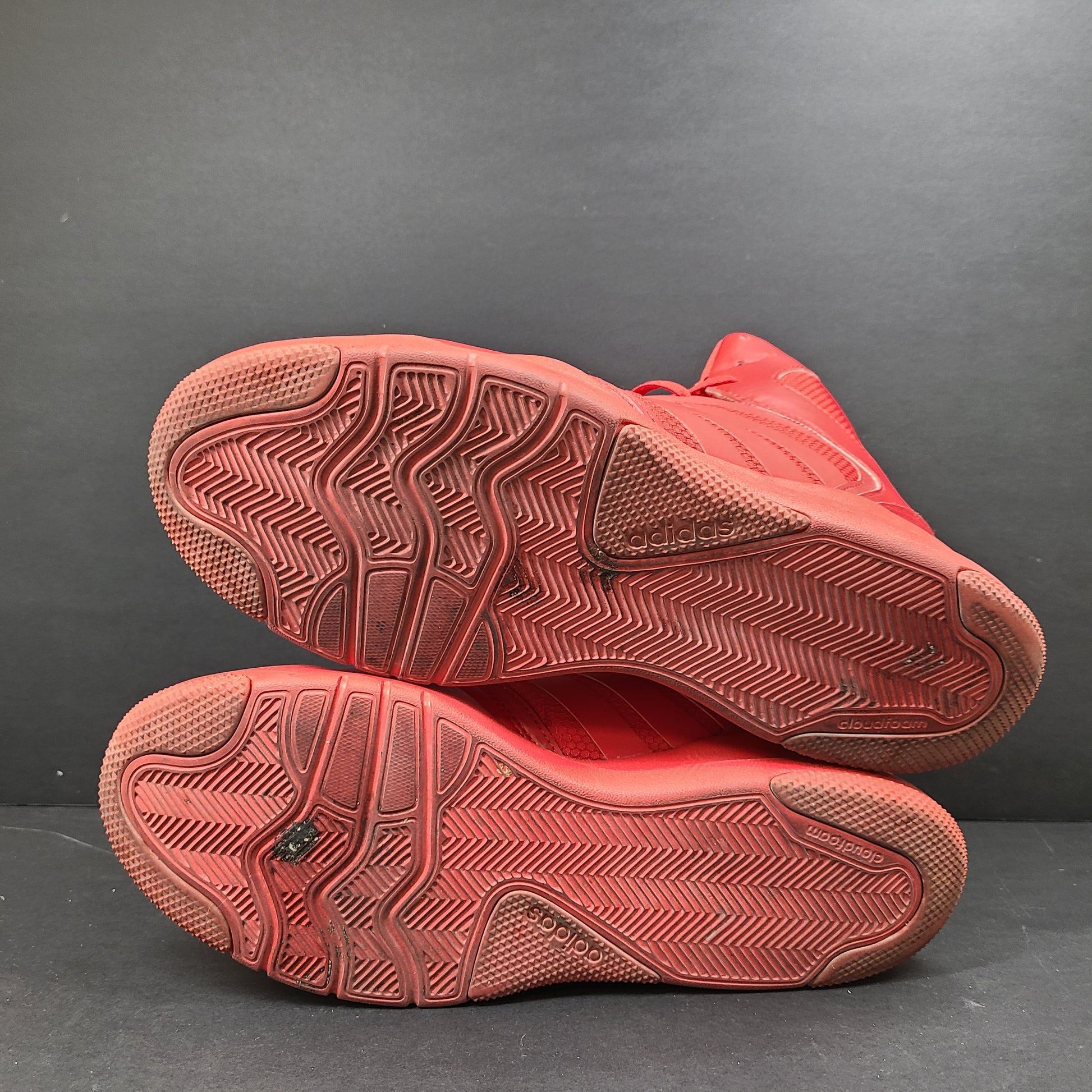 Red Adidas Cloudfoam sneakers size US 8.5 with sole wear and minor creasing.