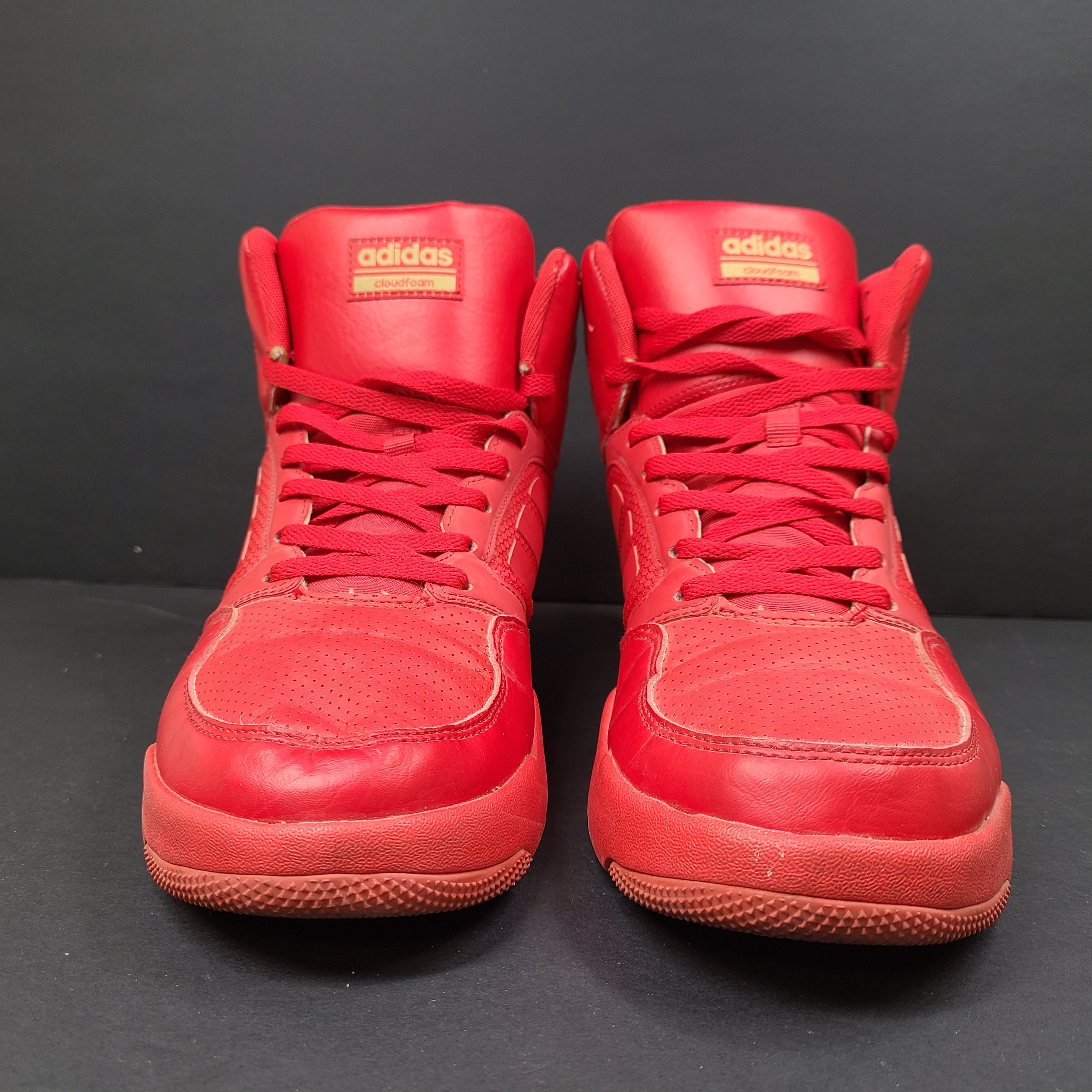 Red Adidas Cloudfoam sneakers size US 8.5 with sole wear and minor creasing.