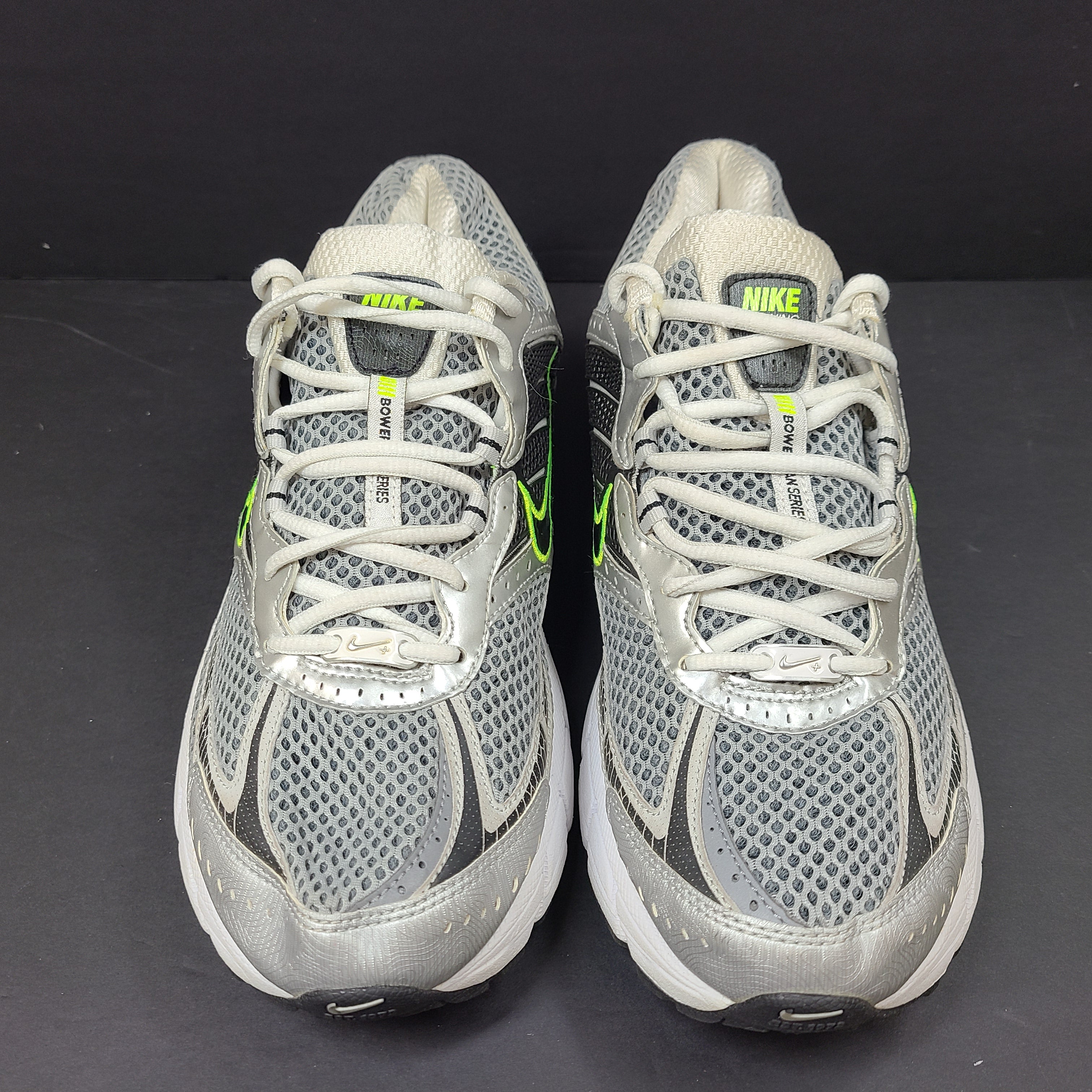 Gray and green Nike Zoom Vomero 3 running shoes in US size 11 designed for responsive comfort and stability.